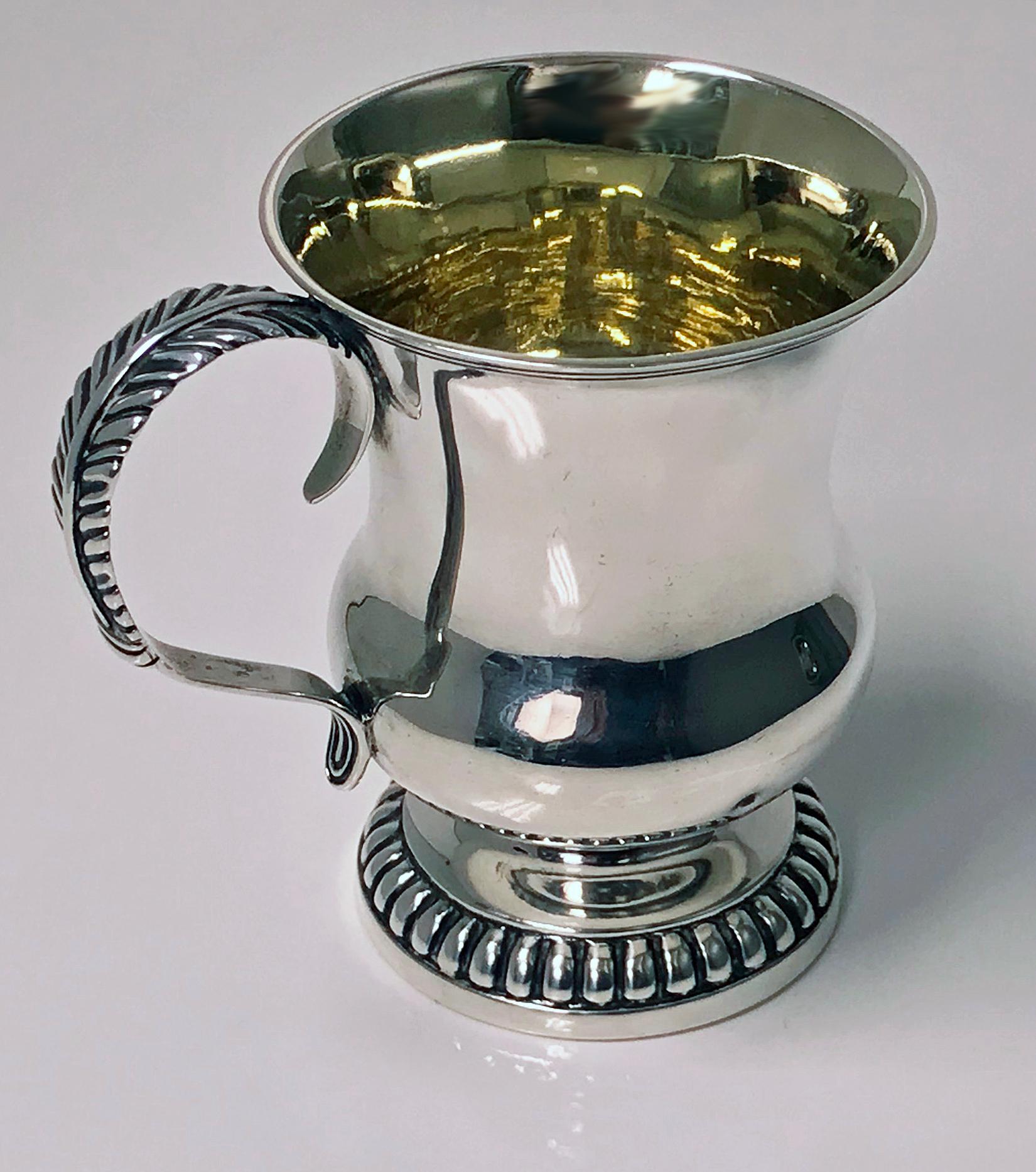 Scottish Aberdeen Provincial silver mug tankard, George Booth, circa 1810-1820. The mug on round lobate pedestal base plain baluster body, foliate scroll handle. Measures: Height 3.75 inches. Weight: 148 grams. Marks Reference: The Goldsmiths of
