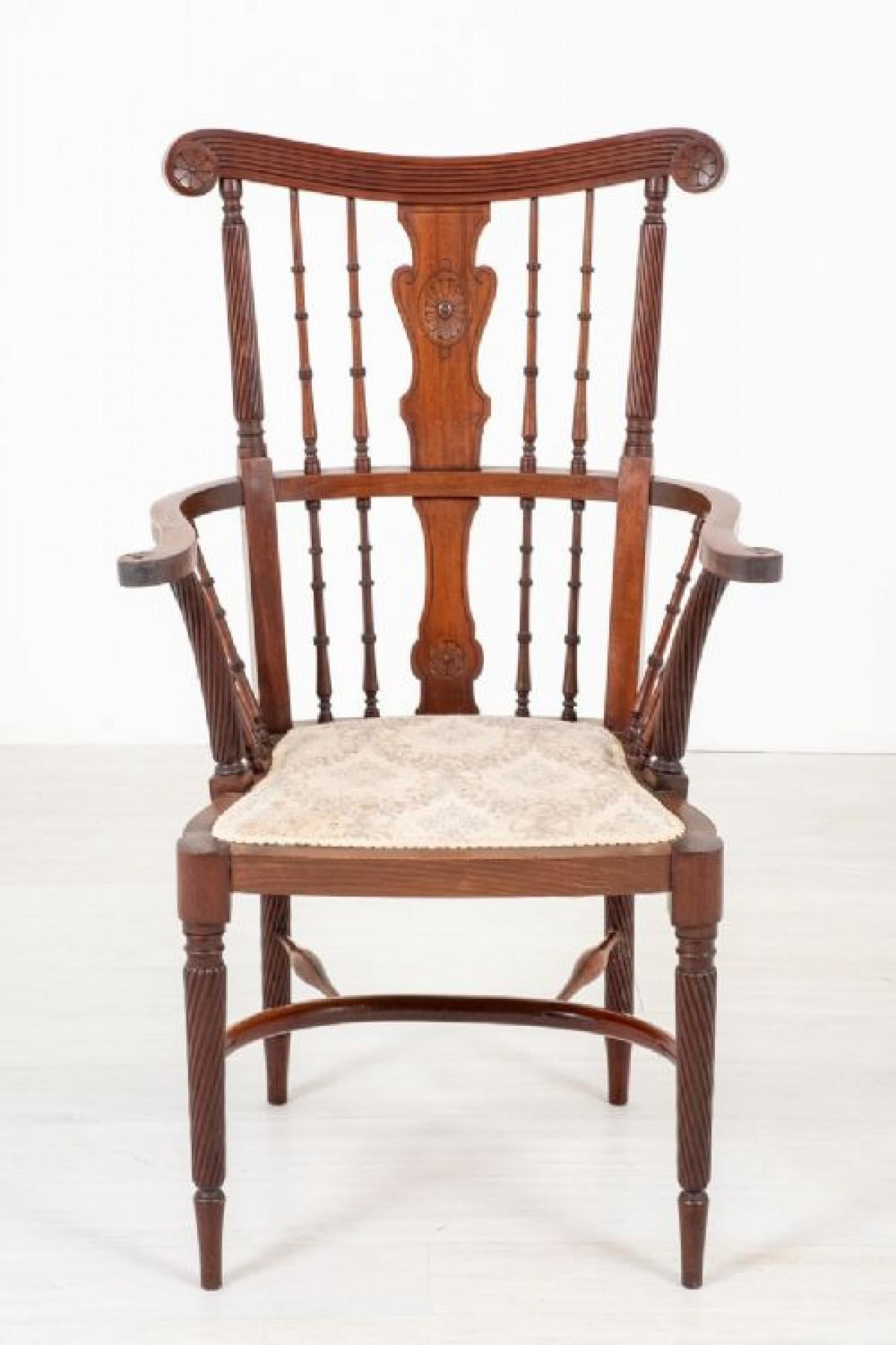 Unusual Mahogany arm chair (Possibly Scottish)
The cresting rail being of a shaped and fluted form with carved patre.
circa 1890
The chair features a carved and shaped back splat flanked by turned uprights and shaped arms.
The legs being of a