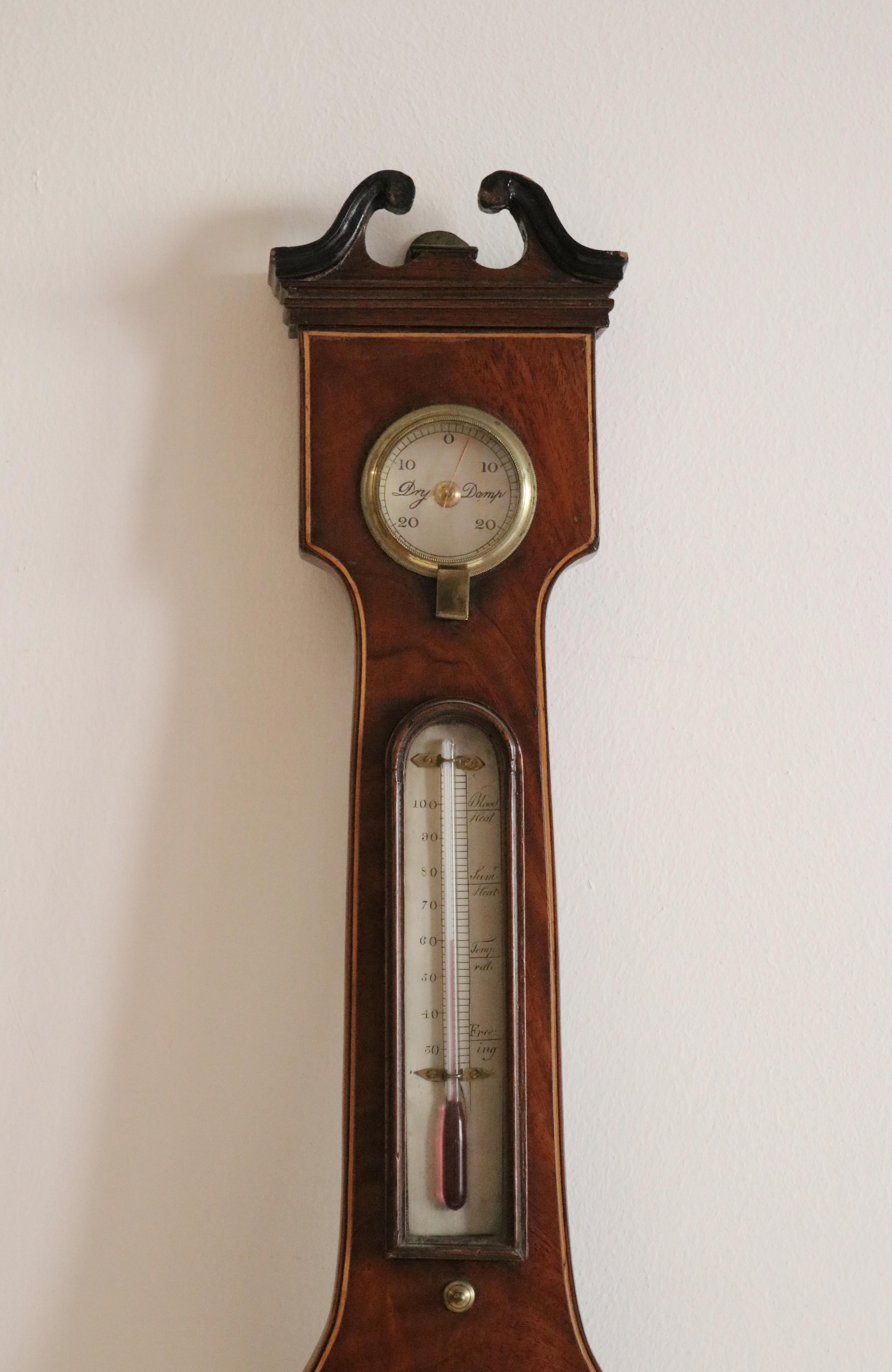 With margin of inlay against mahogany. Also with hygrometer, thermometer and convex mirror. The central dial silverised with very dry, set fair, fair, change, rain, much rain and stormy. With black numerals.

J.D. Torre