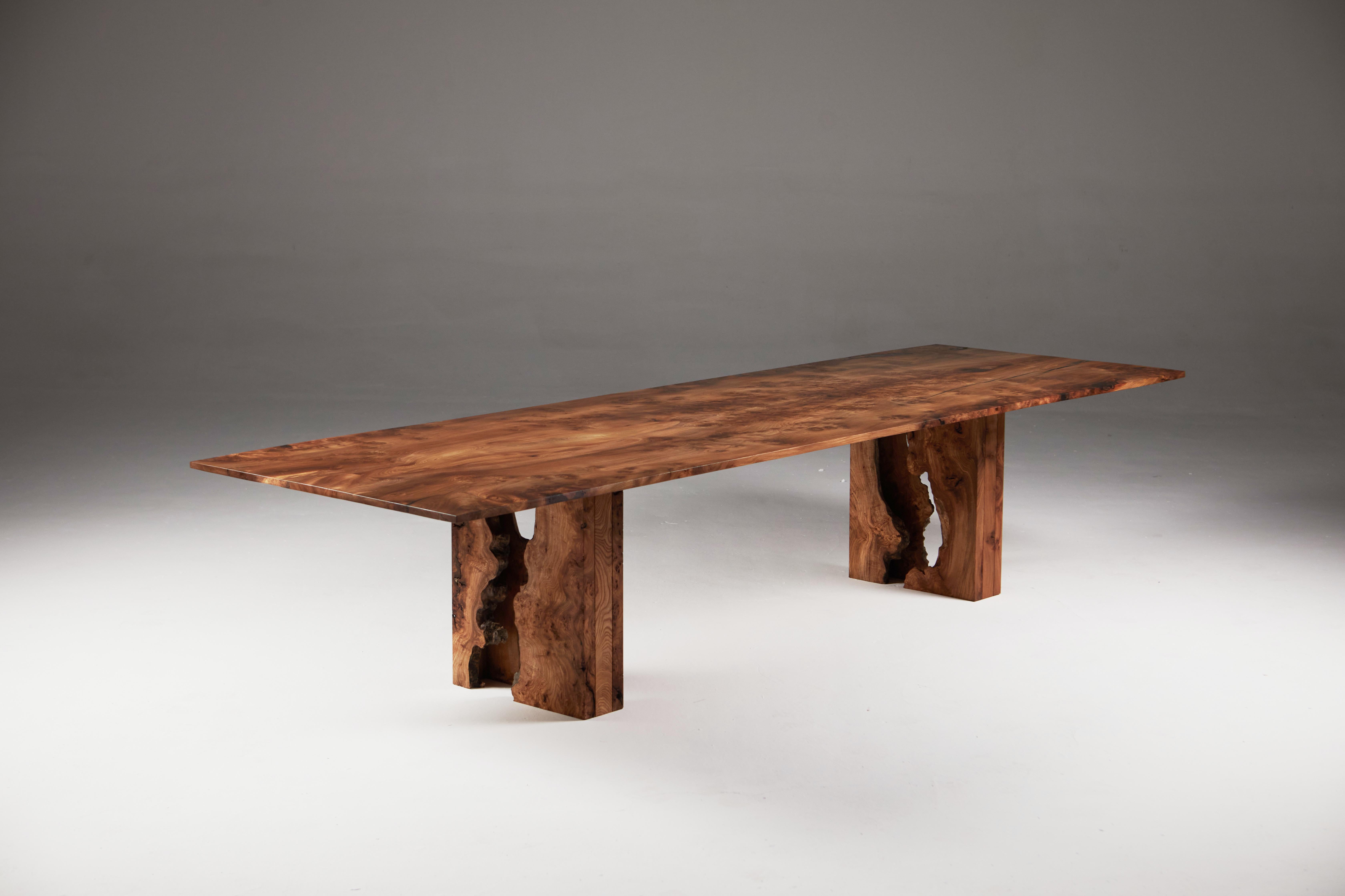 Scottish Burr Elm Table with inverted live edge legs and Bookmatched top.
The third image shows the book-matched top in full made from two slabs of solid elm. The table top is initialled and numbered on the underside with the consecutive project