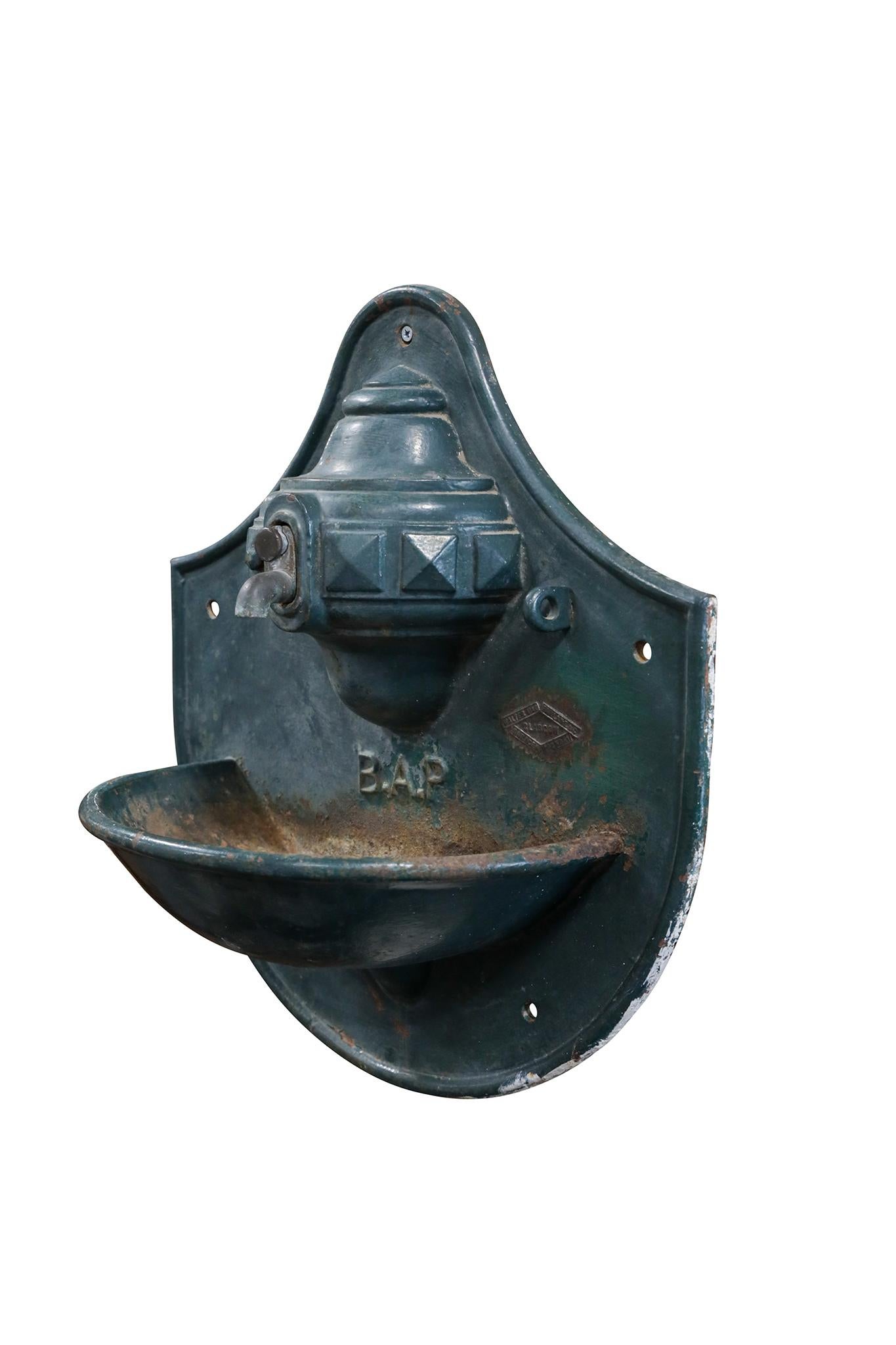Scottish Cast Iron Garden Wall Fountain. Purchased in Argentina, has original brand label and wonderful patina. Circa 1900.

Dimensions: 20 1/2