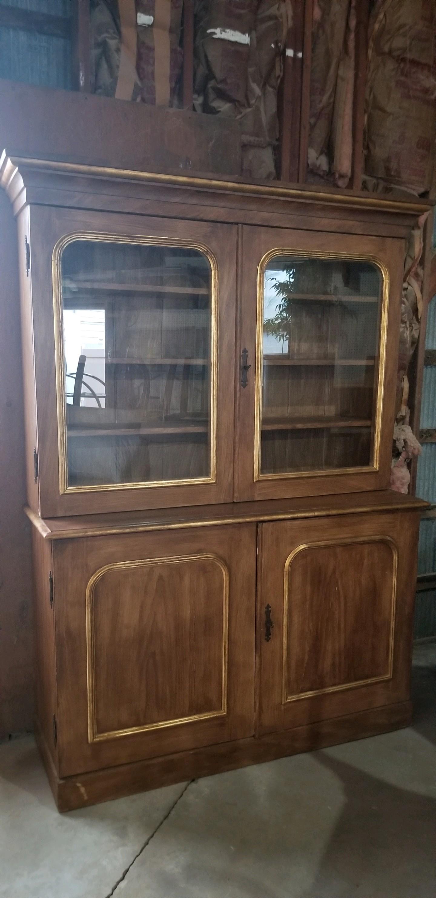 I found this wonderful cupboard in Scotland on a buying trip for a client. It has a wonderful faux bois (grain), and a unique golden leaf edging that I believe was a later embellishment. Once this cupboard hit the other side of the pond, it traveled
