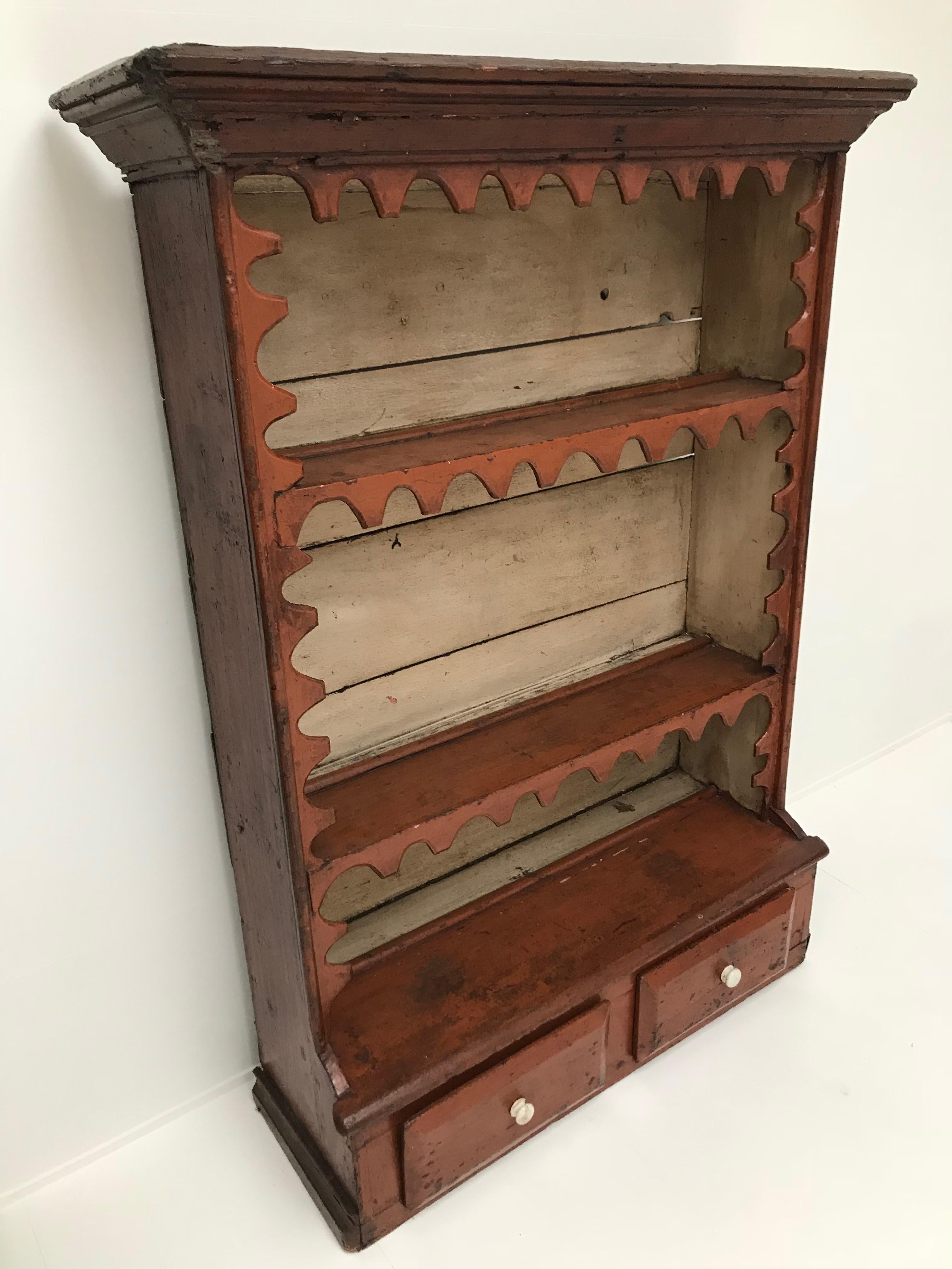 Very nice brown-red painted cupboard from a kitchen, Scotland.
Beautiful old patina.
Two drawers, ideal piece to put or hang in the kitchen.