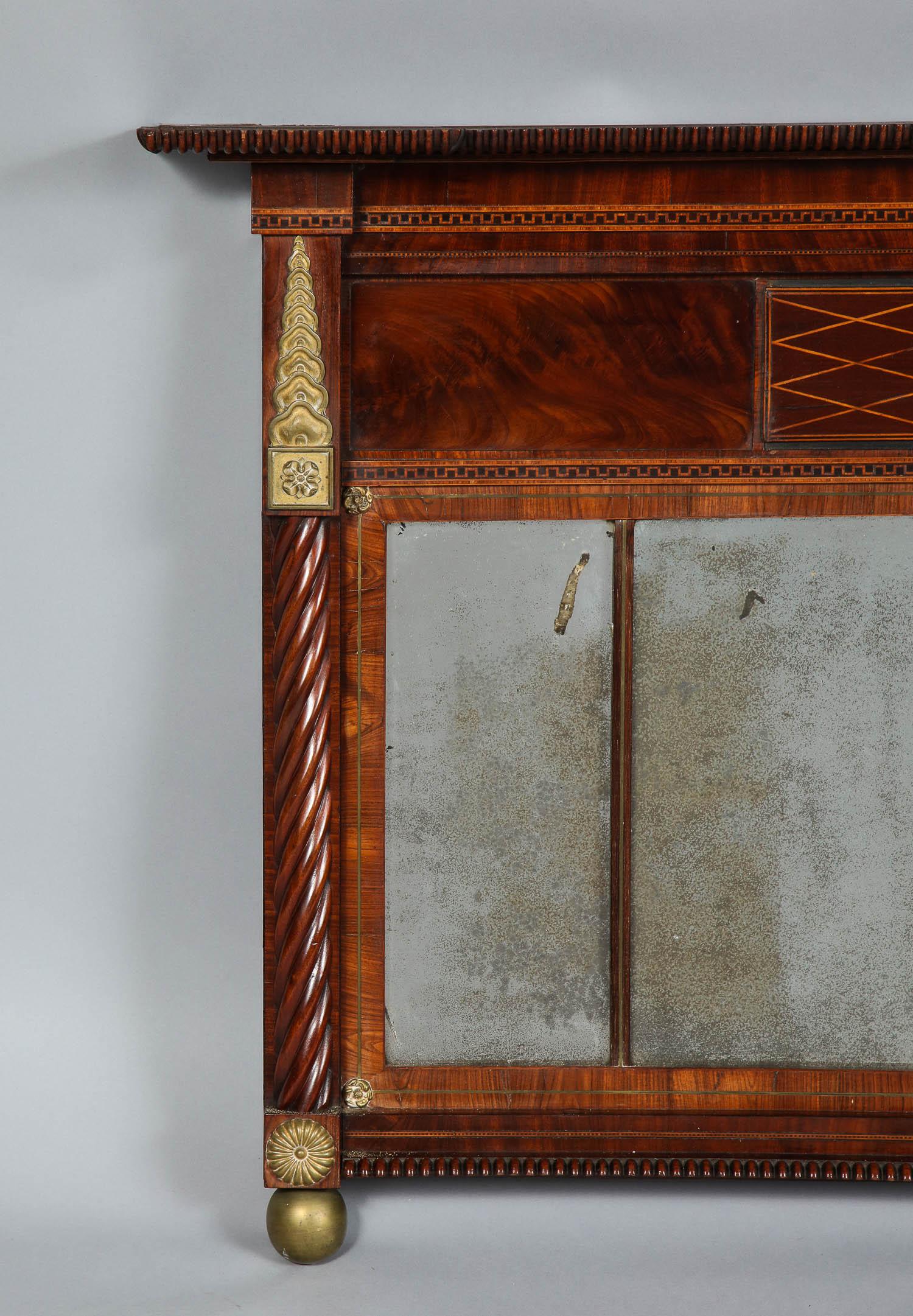 Rare and unusual Scottish Regency period three plate over mantel mirror, having original bronze mounts, highly figured veneer with fine inlay, original mercury glass plates, spiral fluted pilasters and good rich patina throughout. Retaining original