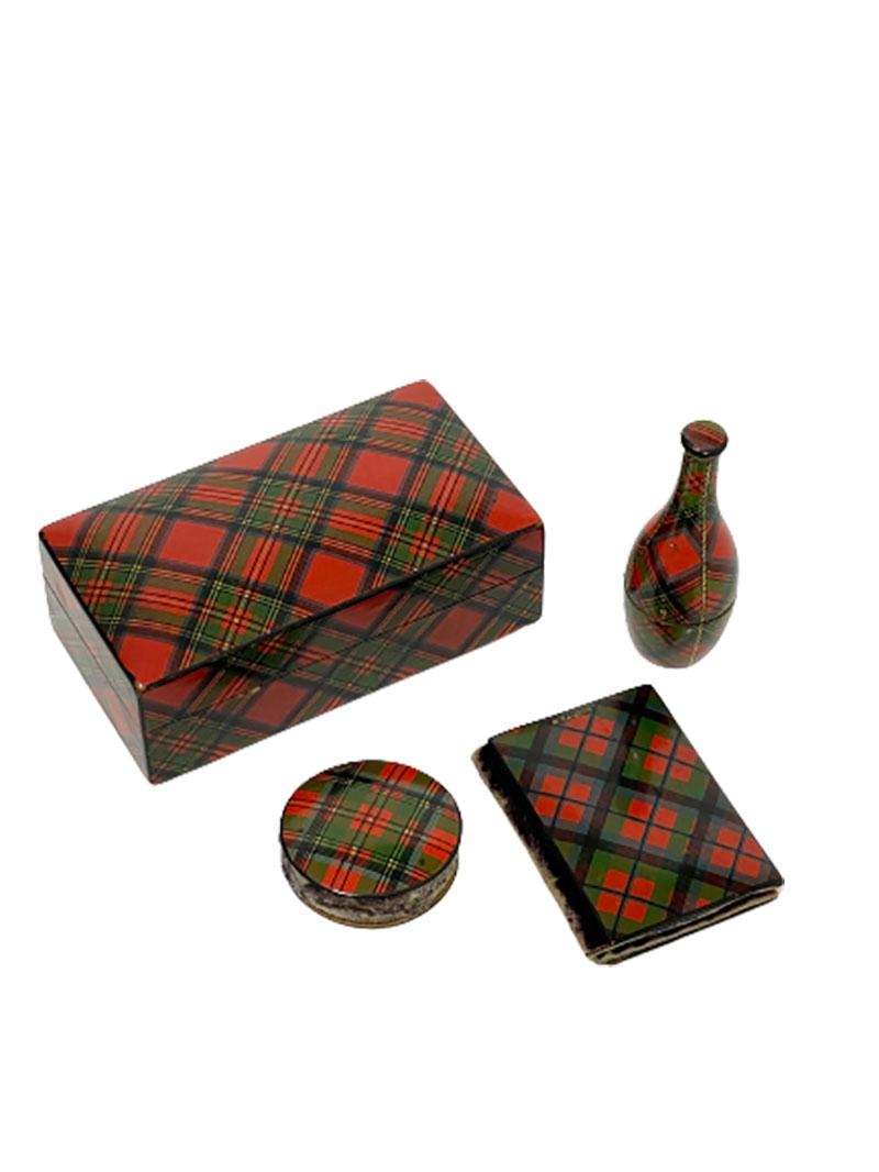 Scottish sewing set of Tartan ware, 19th century

Set of 4 items of Tartanware, Scottish sewing set, exists of a rectangular box, marked by Stuart
A thread dispenser marked by Stuart, a pincushion also by Stuart and a pin book marked by Mc.