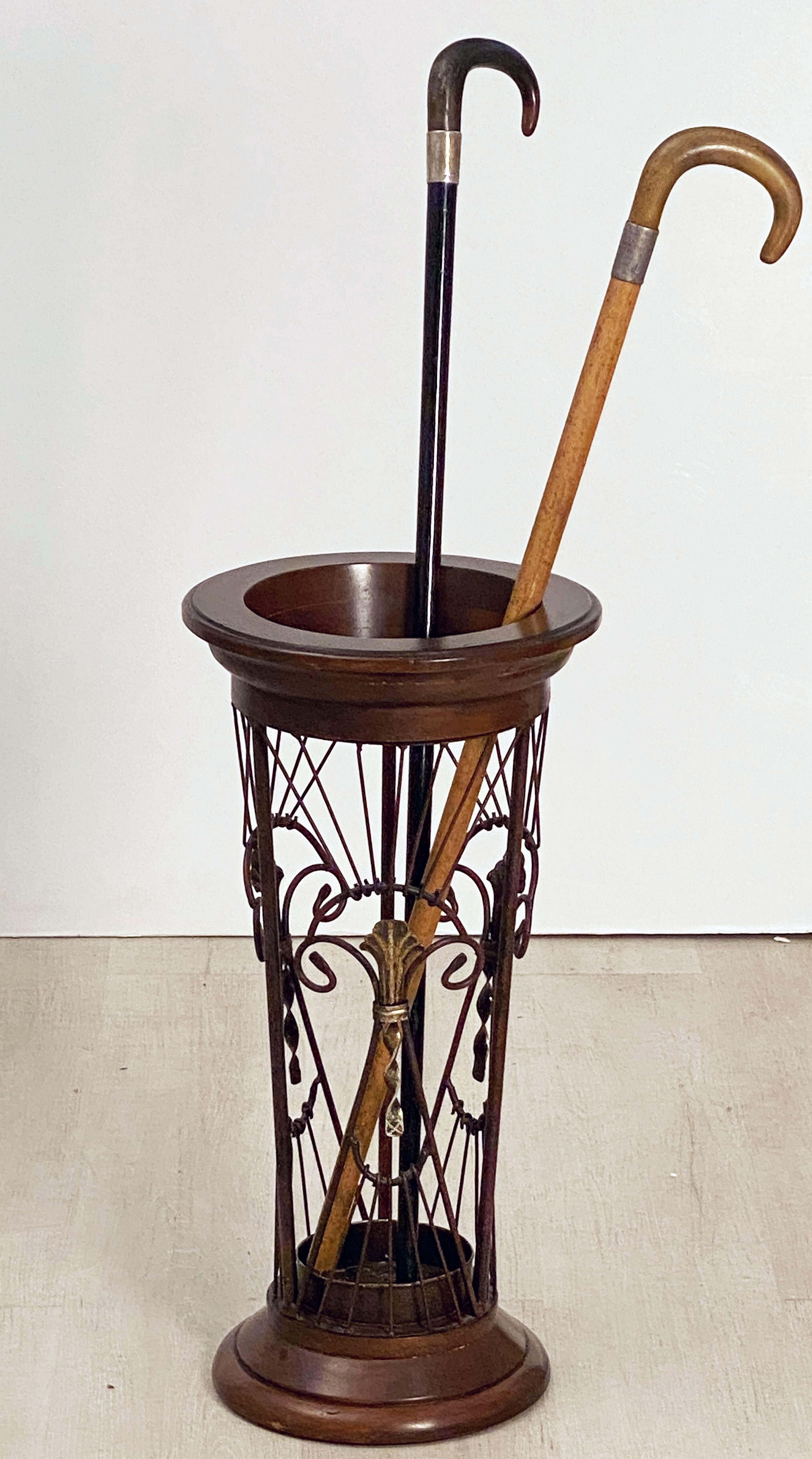 A fine Scottish conical umbrella or stick stand of wood and wound metal with a fanciful design from the Edwardian Era.