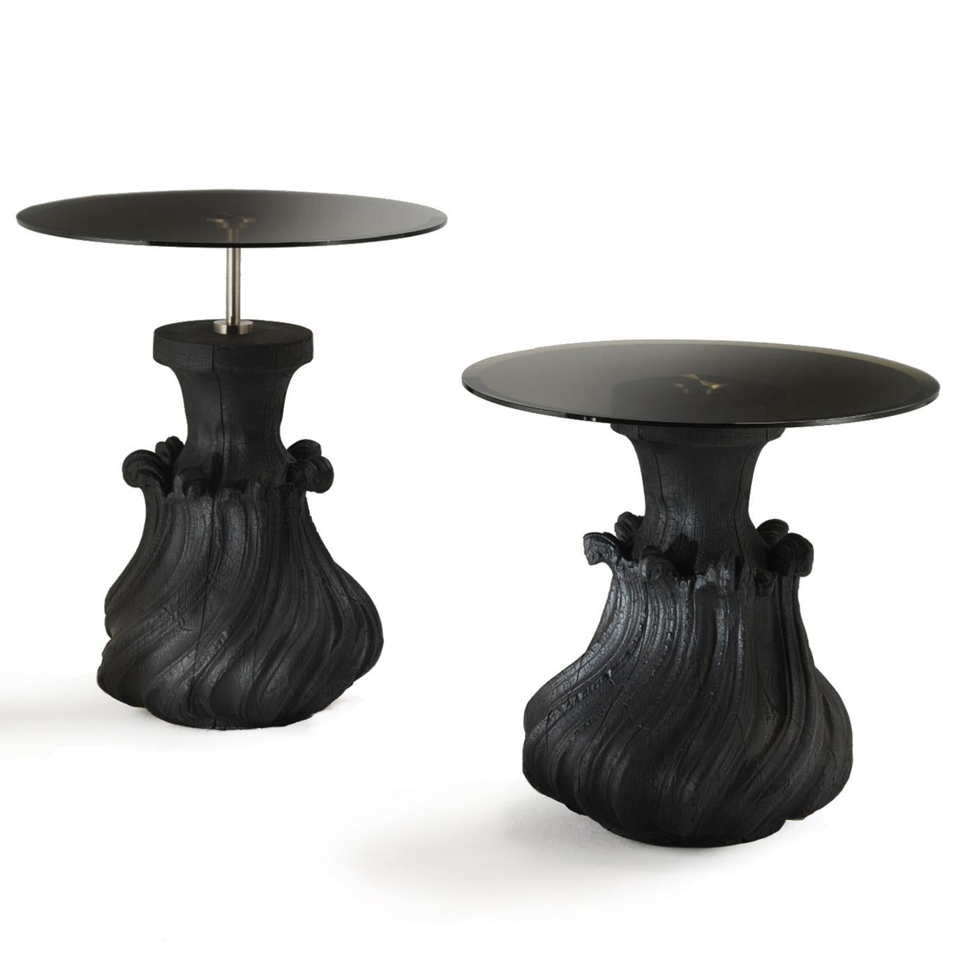 The bold and modern design of this versatile side table is a striking addition to a contemporary or eclectic interior, where it will be a functional surface to display everyday objects or lamps, while also adding a stunning accent. Its wooden