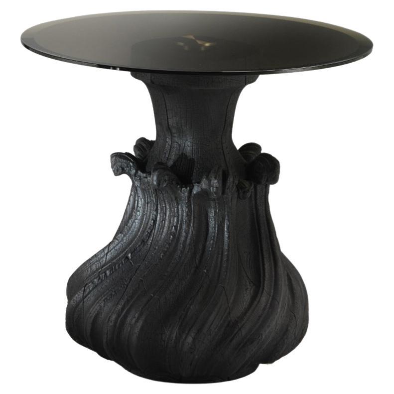 SCOUBIDOU Cocktail Table with Carved Base and Bronzed Mirror Top - burned black  For Sale