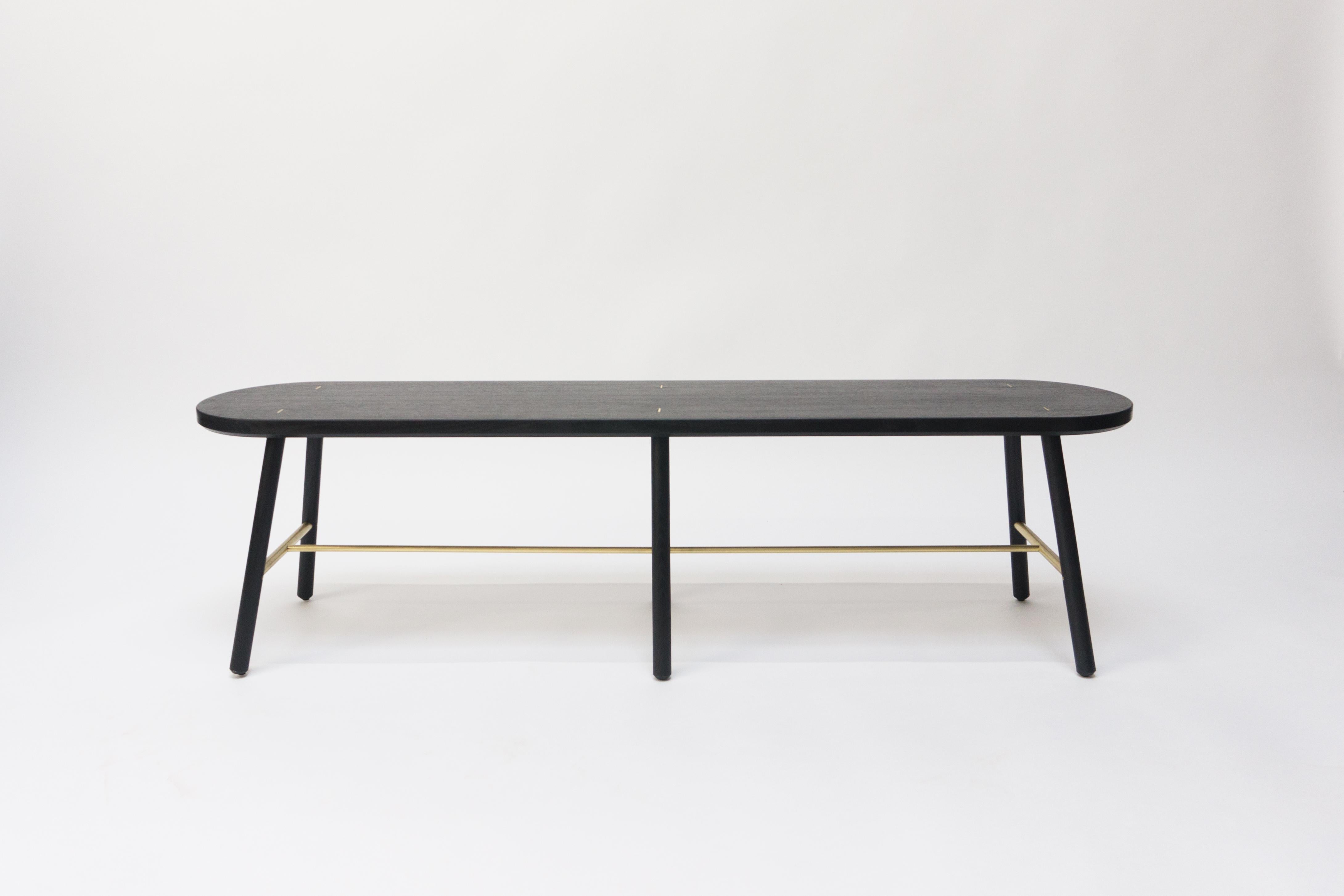 The scout bench has a slim design, allowing it to be tucked into small spaces with a minimal footprint.

Shown in blackened/ebonized oak and brass. Domestic hardwood species available include white oak, walnut, maple or ash. Hand rubbed oil