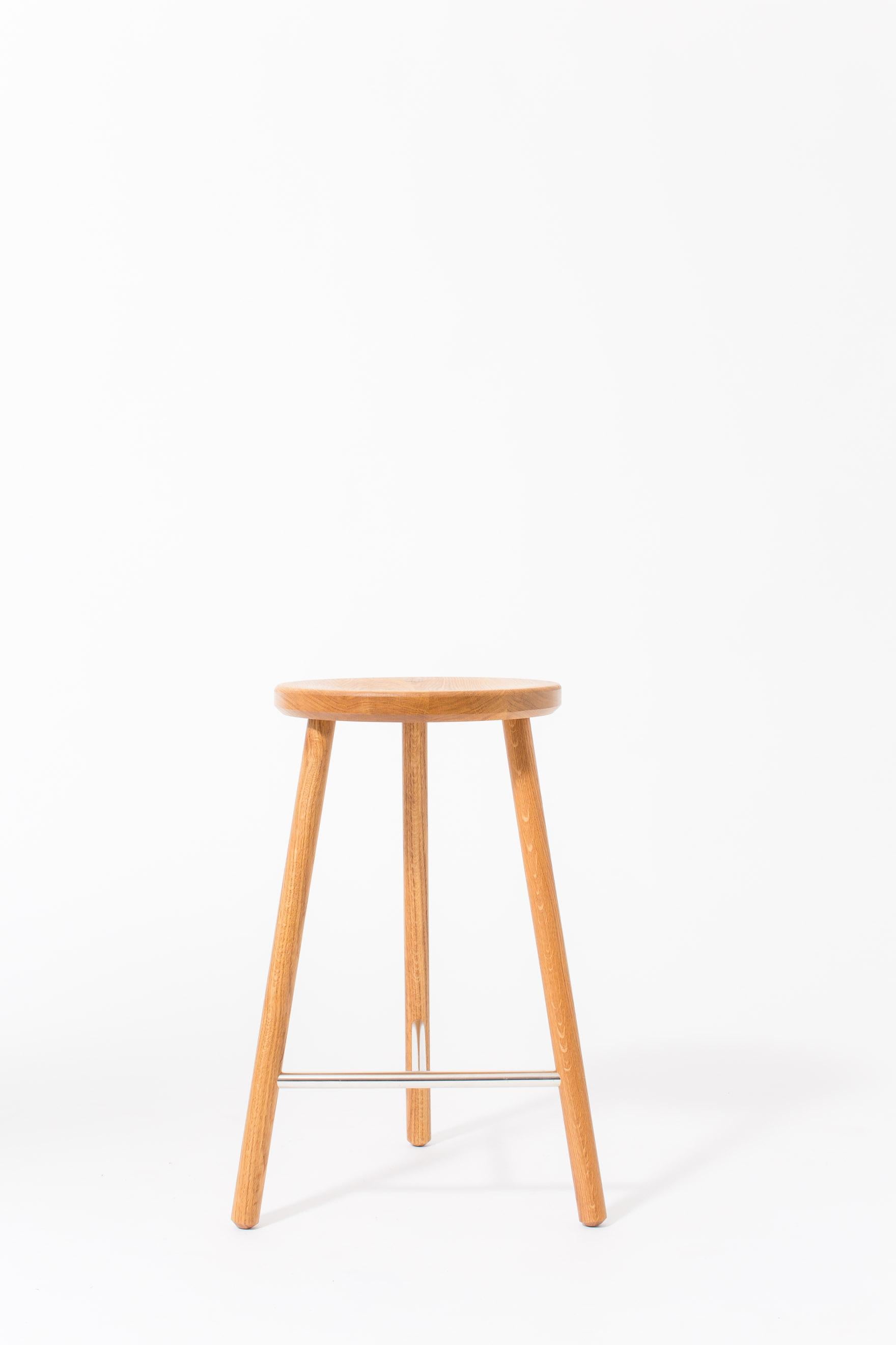 The scout stool has a slim design, allowing it to be tucked into small spaces with a minimal footprint.

Shown in natural white oak and satin nickel. Domestic hardwood species available include white oak, walnut, maple or ash. Hand rubbed oil
