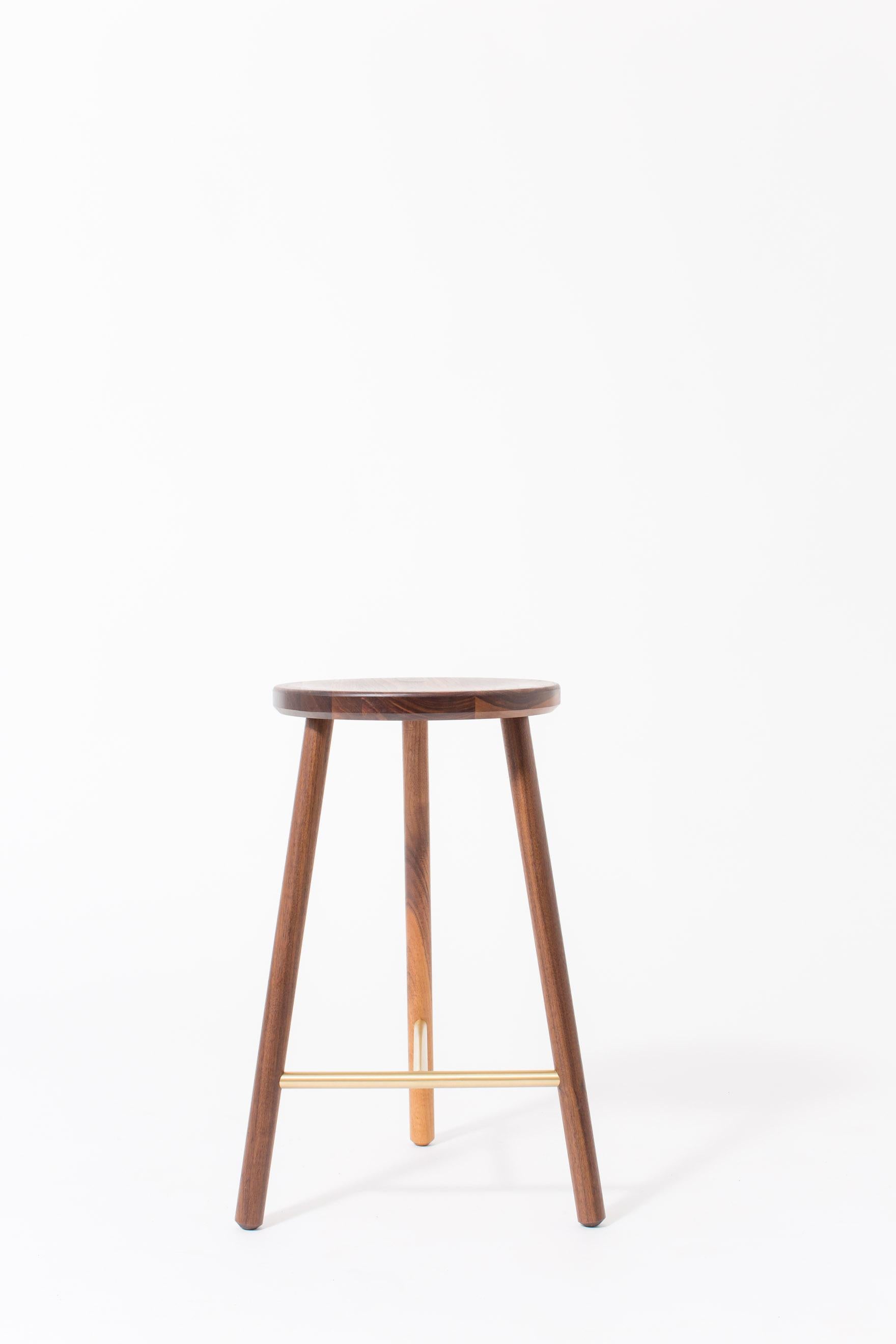 The scout stool has a slim design, allowing it to be tucked into small spaces with a minimal footprint.

Shown in natural walnut and brass. Domestic hardwood species available include white oak, walnut, maple or ash. Hand rubbed oil finish, 0% VOC.