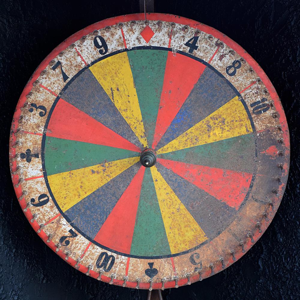 Scratch built fairground wheel 

Mounted on a bespoke cast iron detachable support stand, this unique, folk art, scratch-built fairground roulette wheel is still in fully working order. We would say dated from the mid-20th Century the wheel is