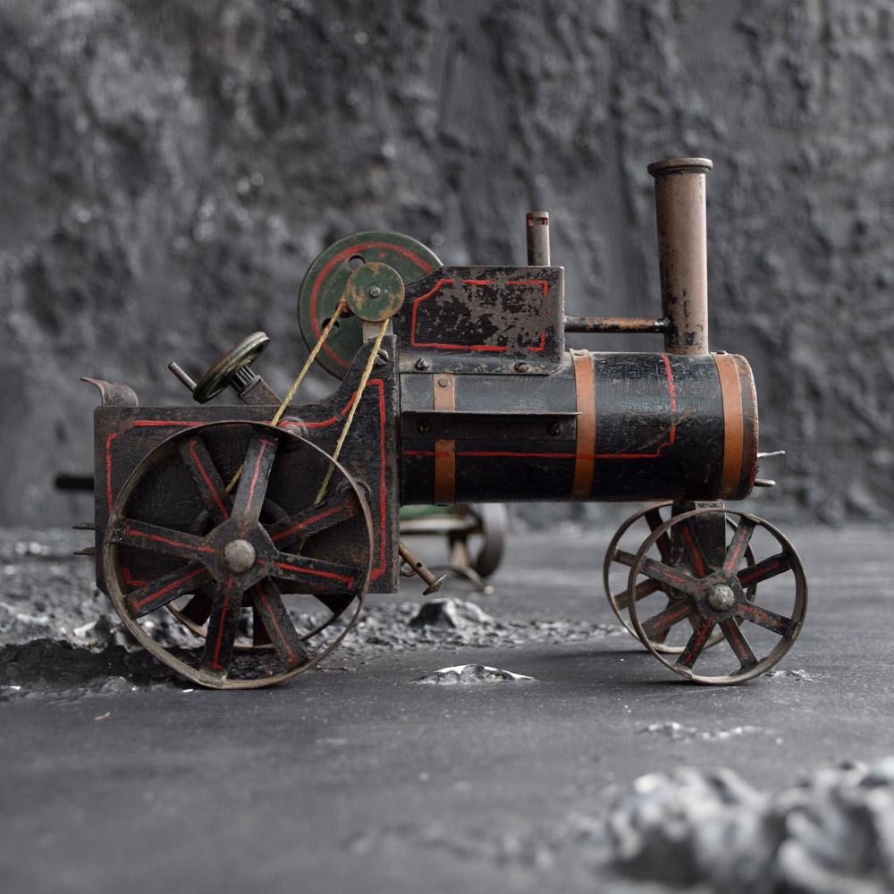 Scratch built train steam engine with trailer dated, circa 1945
We are proud to offer a folk-art English scratch built tin and wood steam train and trailer model. A wonderfully aged example in its true form, rare as these examples were usually made