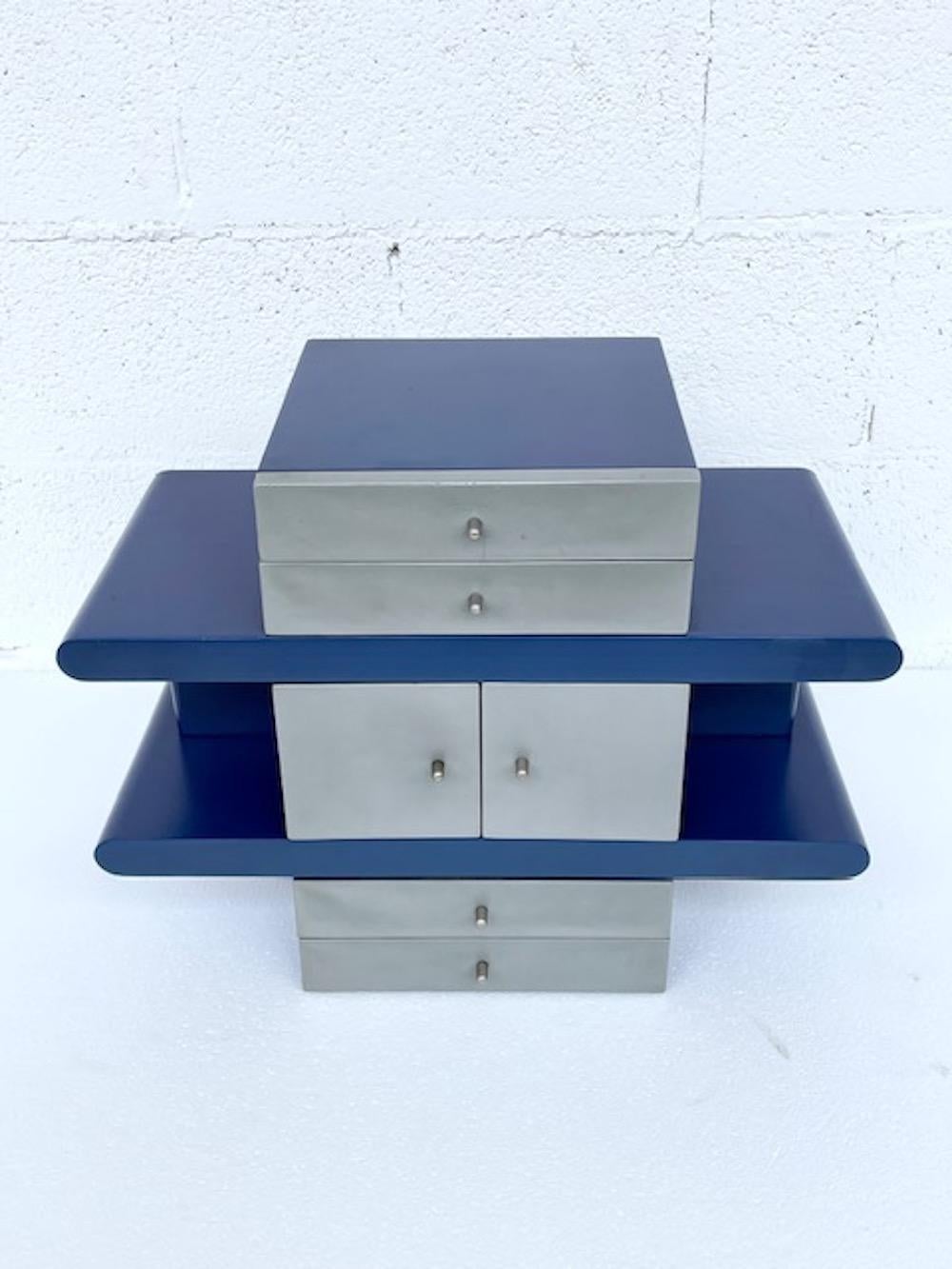 Designed by Hans von Klier for Planula Agliana Manufacturing. Jewelry case Scricciolo model. 
Original jewelry box with a refined and innovative design. The structure is in wood painted in shades of blue and satin silver. Small drawers allow the