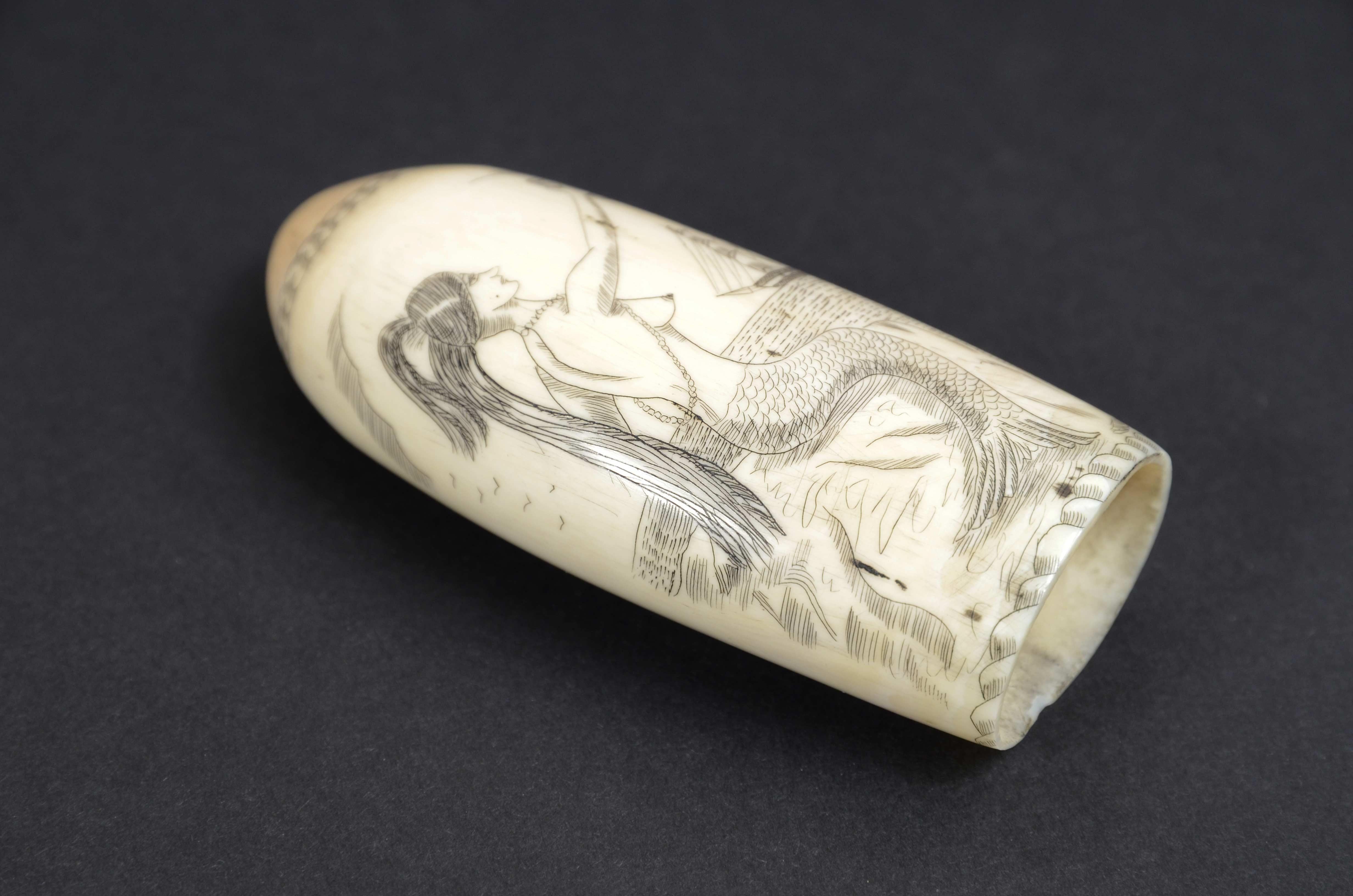 Scrimshaw of whale tooth with vertically engraved mermaid mid-19th century 1