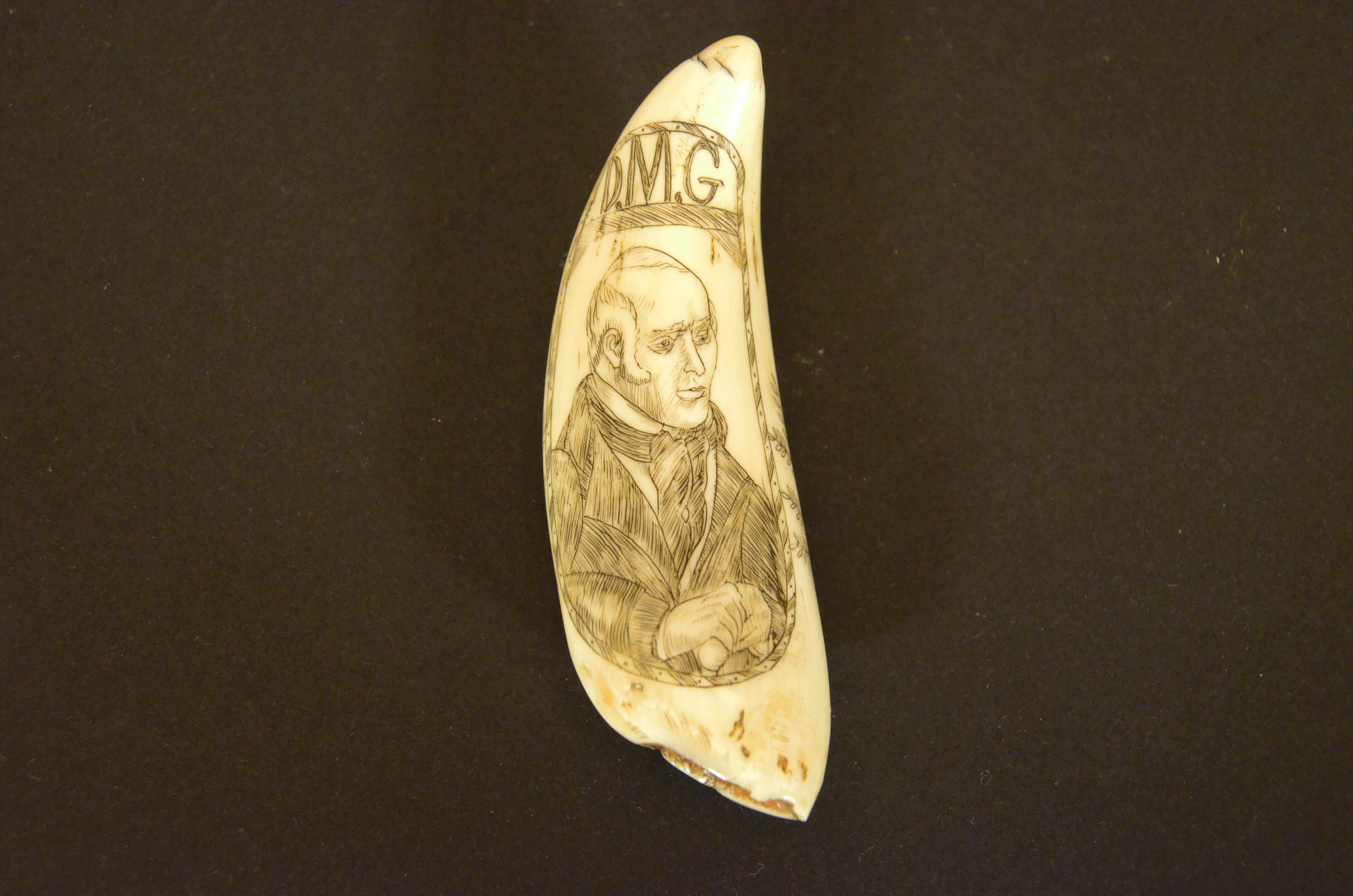 Scrimshaw of an engraved whale's tooth, depicting on one side, truncated pyramid cippus culminating with a half sphere and surmounted at the top by a six-pointed star, symbolism traceable to Freemasonry, and at the bottom the date 1820 and above the
