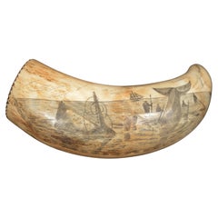 Scrimshaw of engraved whale tooth dated 1867 with whaling scene