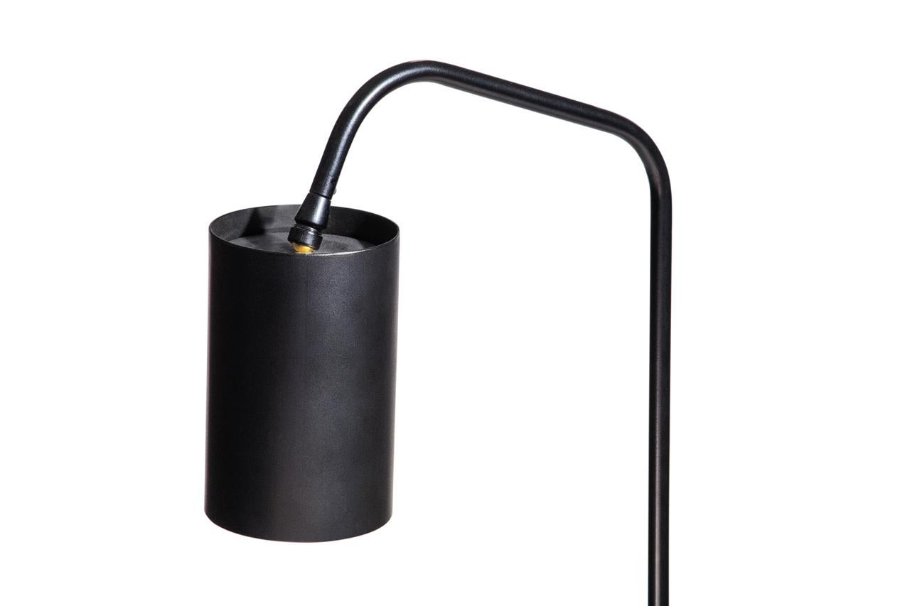 A tripod side table and reading light combine to make a beautiful form perfect for any environment. Like an antiquated whaling tool, this floor lamp works well next to a bed or a chair, and the floor switch features a minimal design. The 'Scrimshaw'