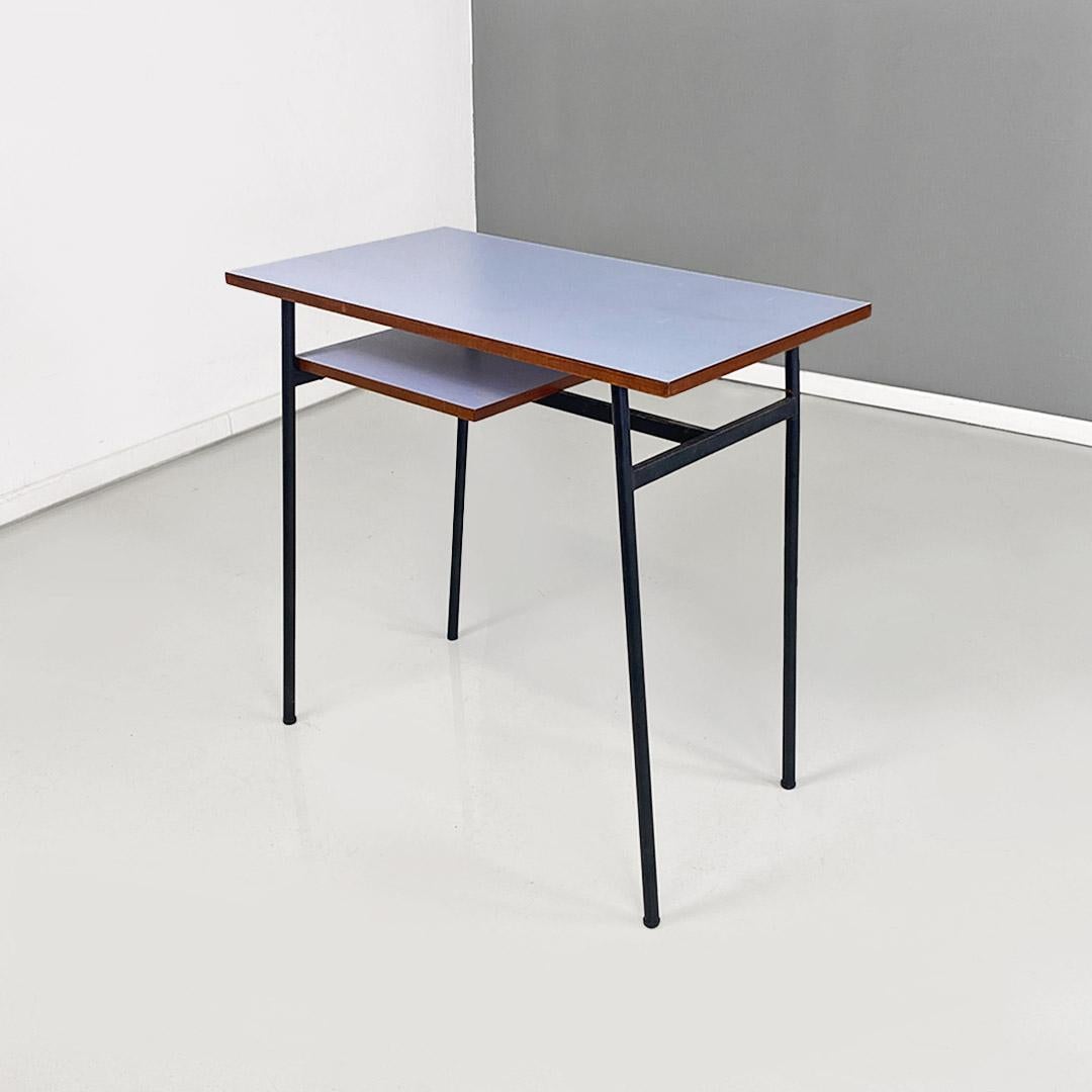 Blue formica and black metal desk, Italian modernism, ca. 1960.
Small desk from a hotel room with a matte black tubular metal frame and a rectangular-shaped top made of light blue Formica.
1960 ca.
Perfect condition, fully restored, both the surface