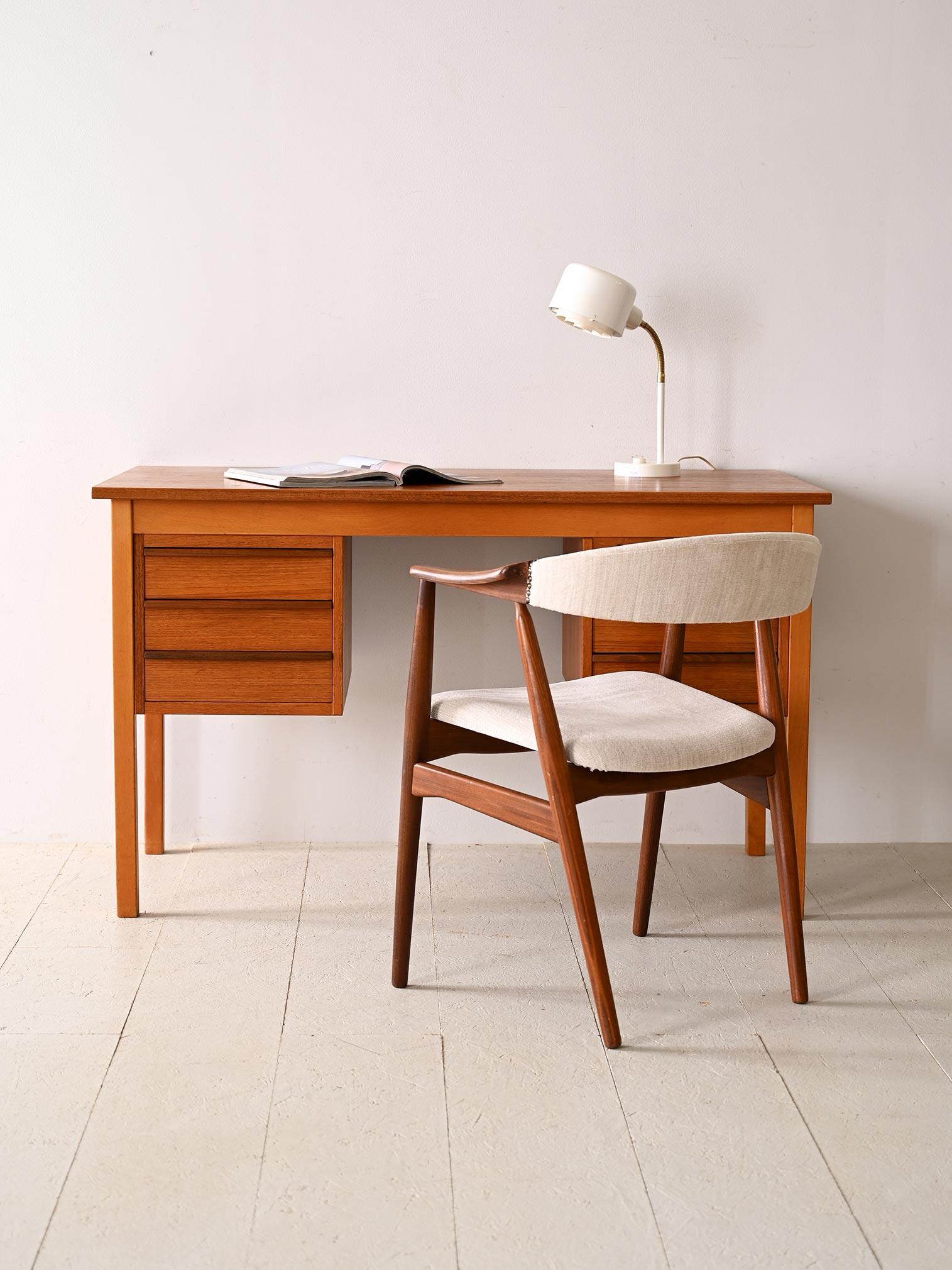 Vintage teak and birch office table. 

Featuring a combination of timeless elegance and practical functionality, this desk is perfect for those seeking a classic design with a modern twist. Square legs add stability and solidity to the cabinet,