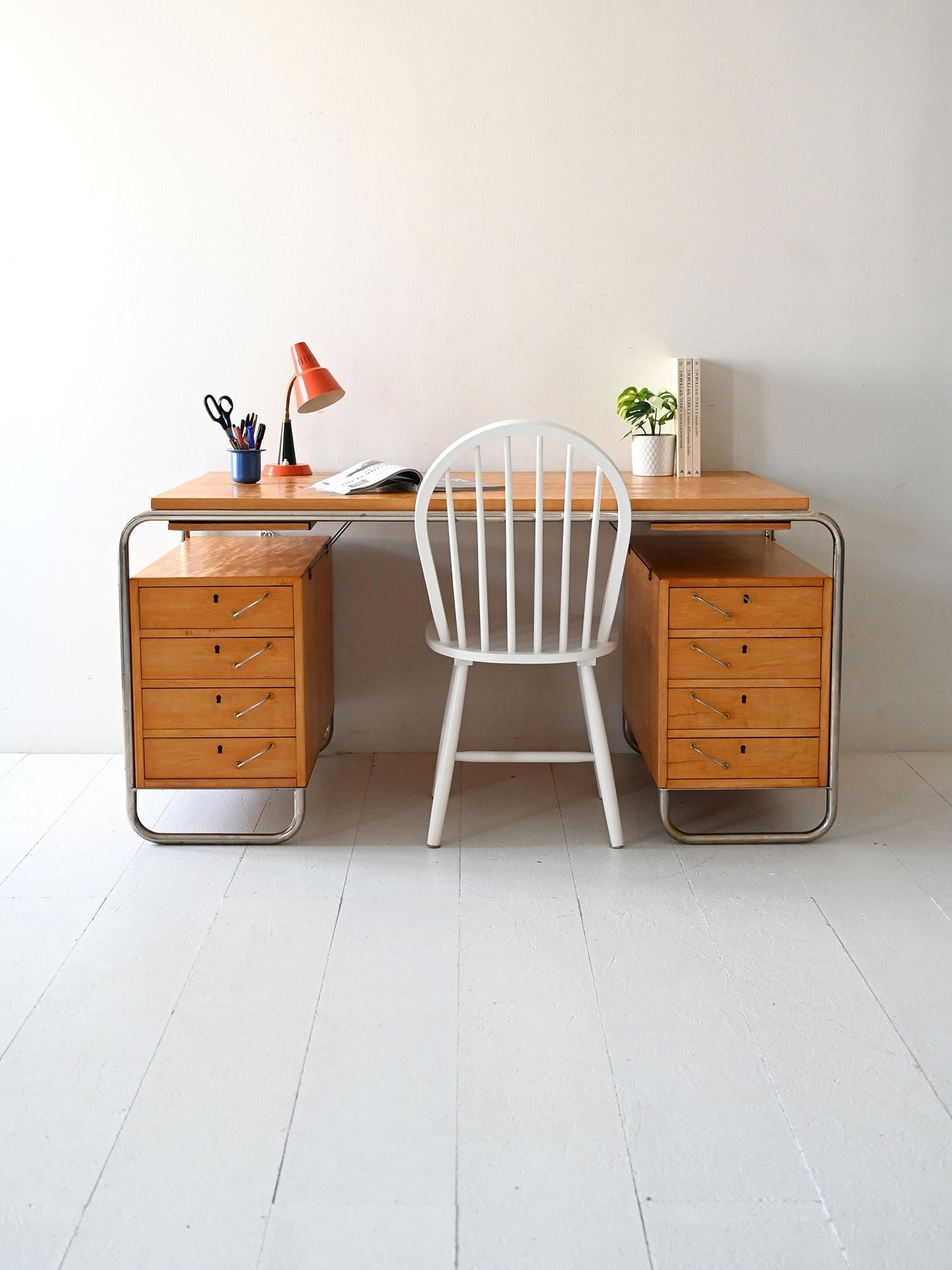 Scandinavian vintage freestanding birch desk with steel frame and double drawer block, designed by Mücke & Melder in the 1930s.

Elegant Scandinavian desk from the 1930s designed by Mücke & Melder, with chrome-plated tubular steel frame and birch