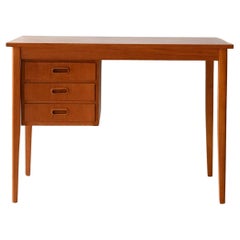 Bureau scandinave en teck avec trois tiroirs