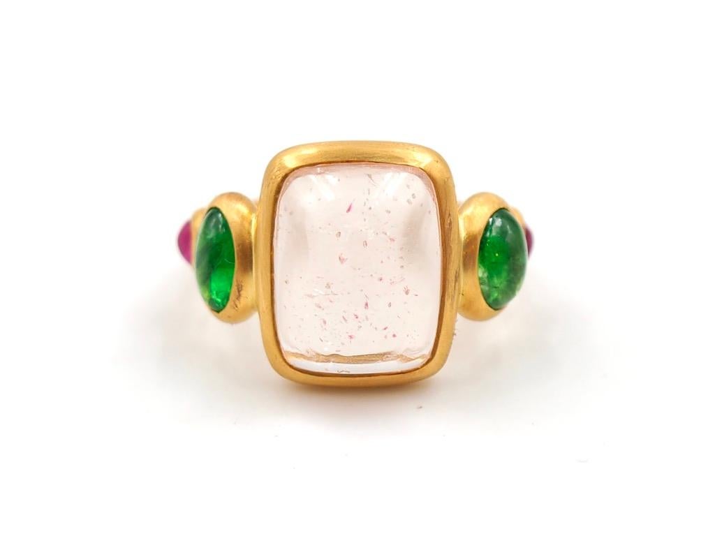 This delicate ring is composed of 5 stones in line: 1 Morganite (pink beryl) sugarloaf, 2 Tzavorite (green garnet) cabochons and 2 natural Ruby sugarloaf cabochons. The center stone is a Morganite  of 10.7 cts. It is natural with no treatment. It
