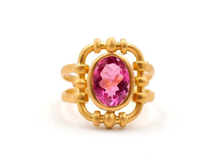 This intemporal ring, designed by Scrives, is composed of a hot pink Tourmaline of 2.83 carats. The color is a strong and shiny pink. The stone is faceted in an oval shape. The tourmaline is natural with no-eye visible inclusions and no