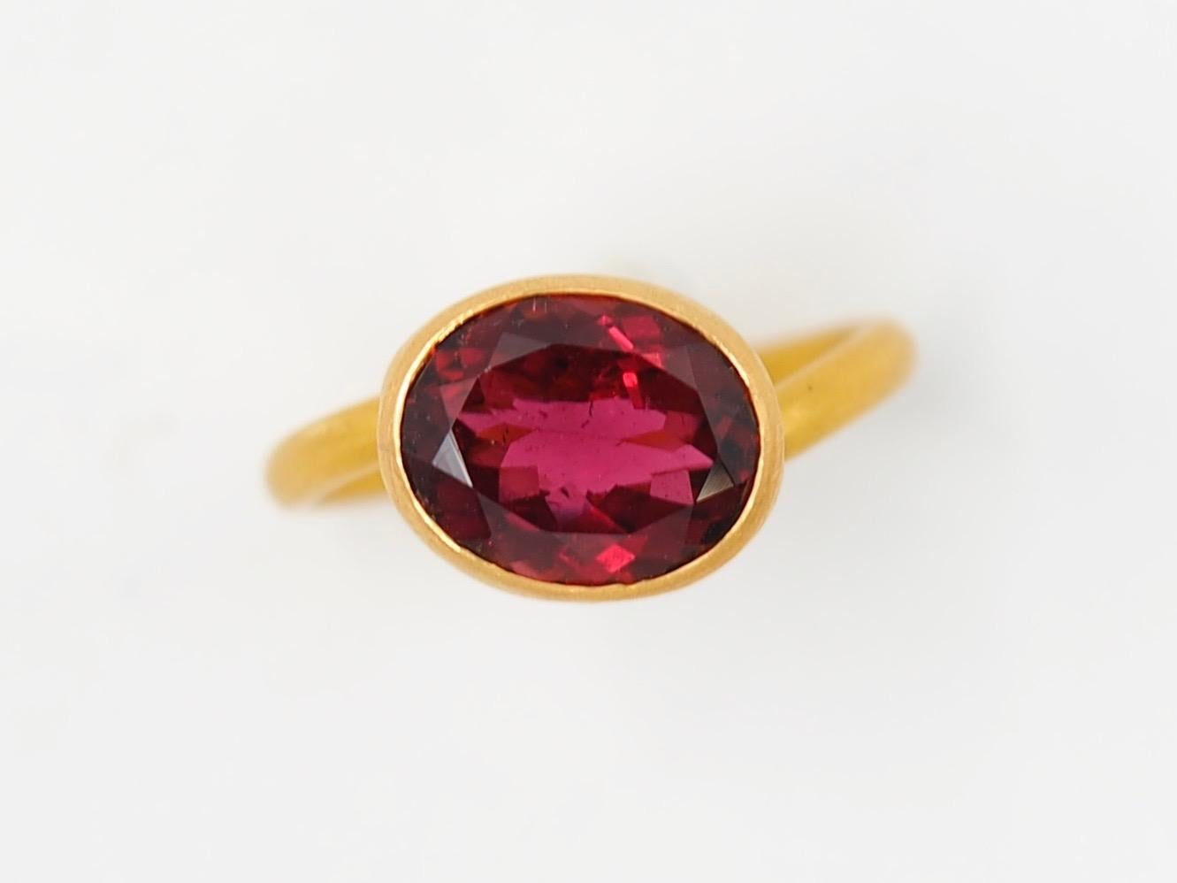 This delicate ring by Scrives is composed of a deep purple tourmaline of 3.45 cts. 
This design allows light to come into the stone from multiple directions and put into highlight the stone. This ring design has been conceived to be worn adding with