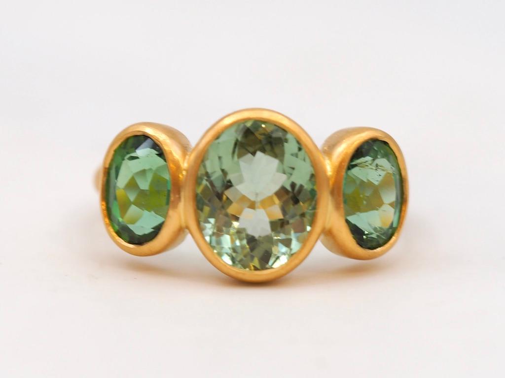 Oval Cut Scrives 4.17 Carat Green Tourmaline Three Stones 22 Karat Gold Handmade Ring For Sale