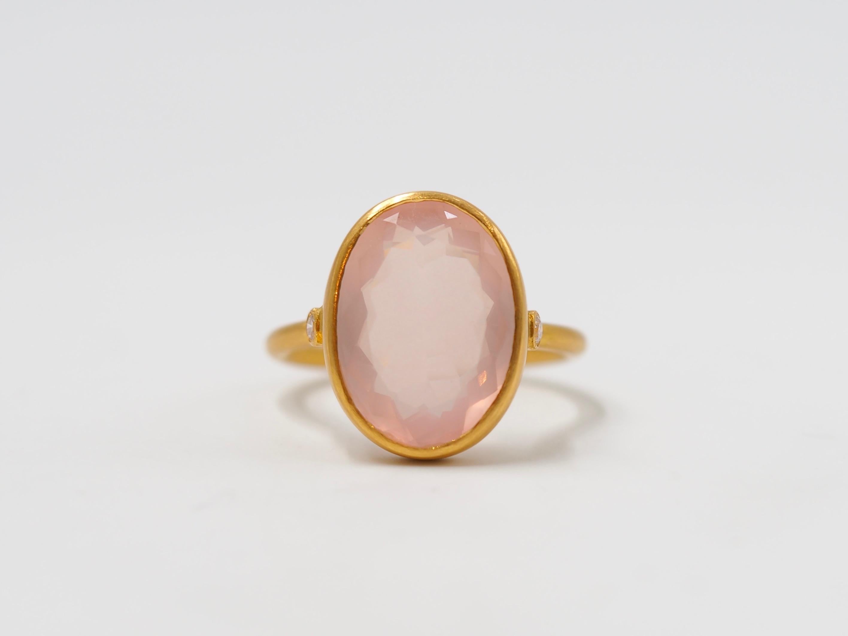 This delicate ring by Scrives is composed of a faceted rose quartz of 6cts and 2 small white diamonds on the side. 

The stone is a natural rose quartz and can exhibit natural and typical inclusions but not eye visible. 

This one-of-a-kind ring is