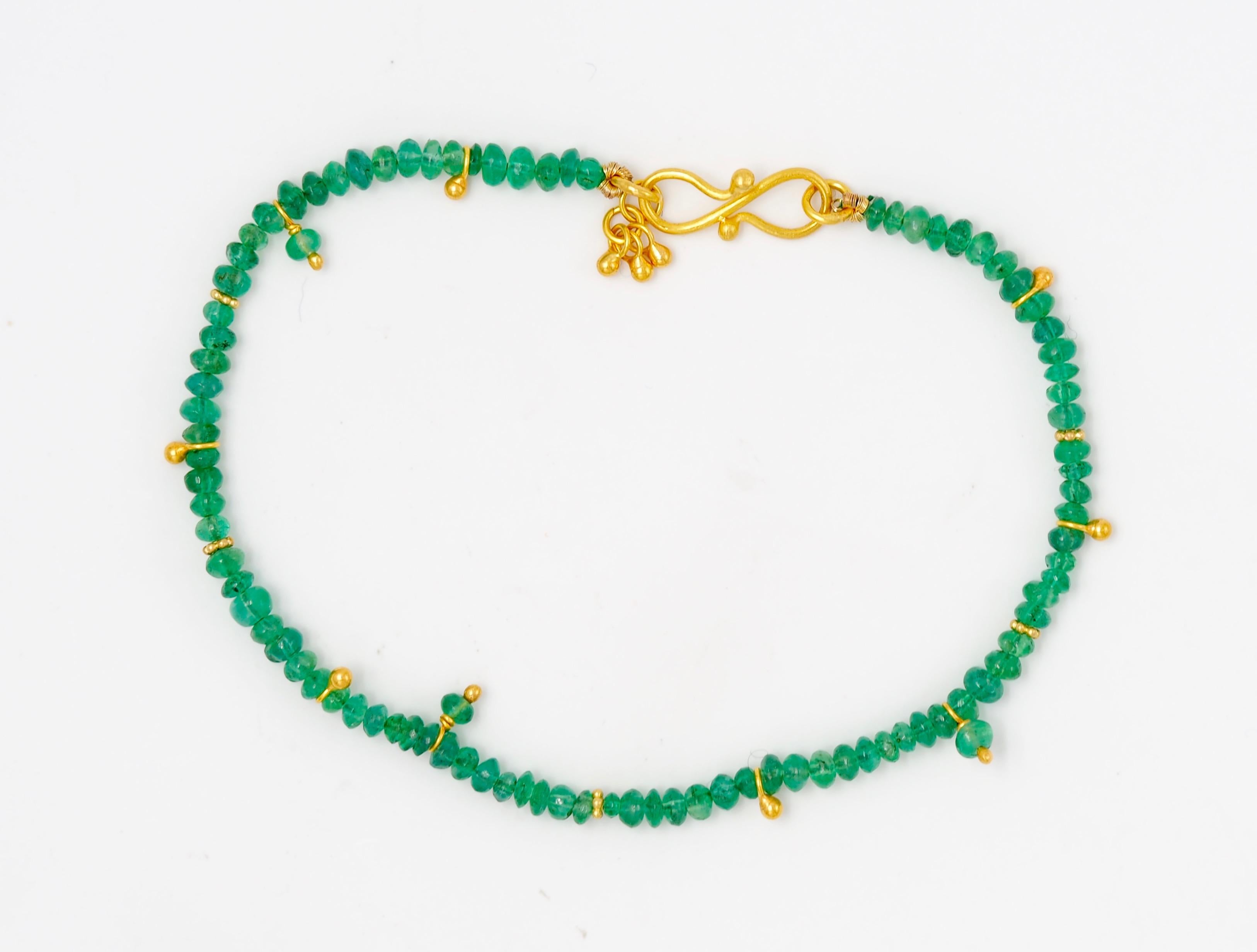 The beads of this bracelet by Scrives are made from natural emeralds of pure emerald green colour (approx emerald weight: 9 carats). The beads have all been hand-cut so they all have different shapes.
Few elements have been placed randomly (gold