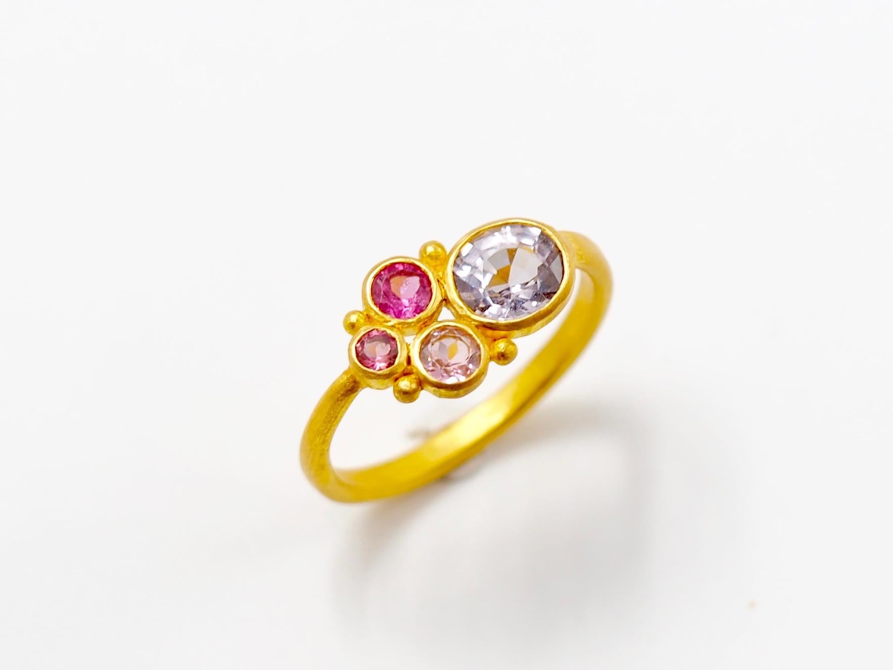 This one-of-a-kind ring by Scrives is composed of a light grey spinel of 1.04 cts and 3 tourmalines of 3 hues of pink. All 4 stones have different sizes. The colour of the grey spinel is original and rare, a pure light grey.   

The stones are set