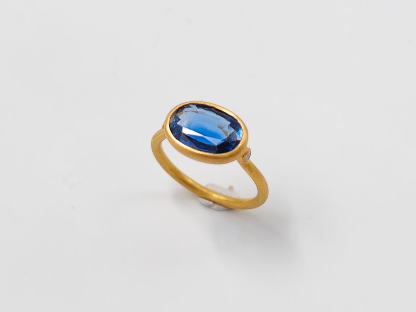 This delicate ring by Scrives is composed of a faceted kyanite of 3.6cts and 2 small white diamonds on the side. 

The stone is a natural kyanite and can exhibit natural and typical inclusions but not eye visible. 

This one-of-a-kind ring is