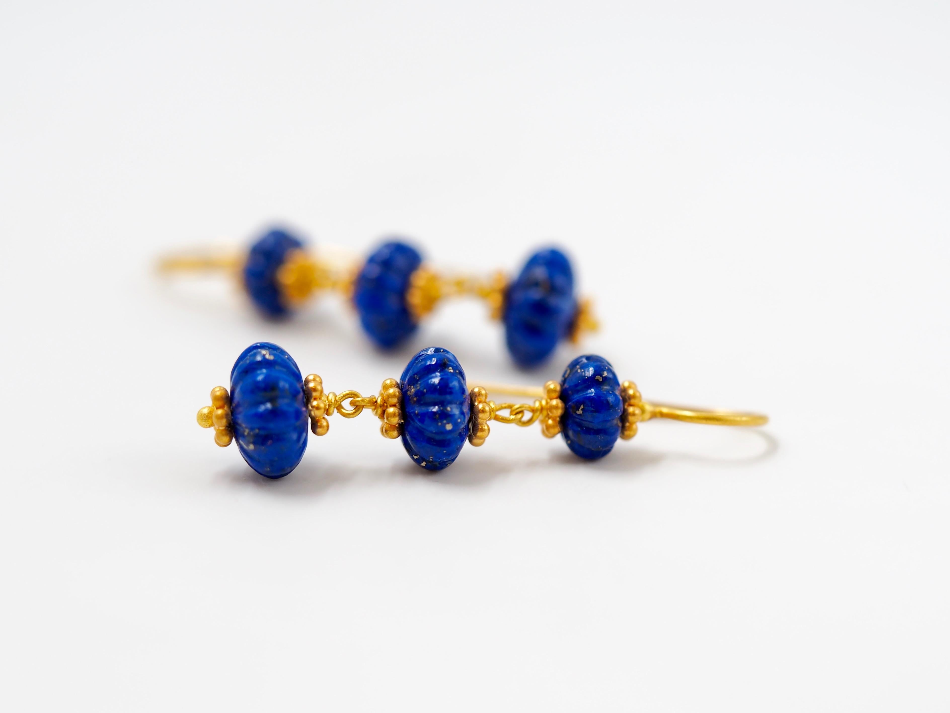 These earrings by Scrives are made of 6 watermelon shape beads of lapis lazuli for a total weight of approx 17 cts.
The watermelons show decreasing sizes. 
The same earrings exist also in translucent aquamarine and in amethyst.

This one-of-a-kind