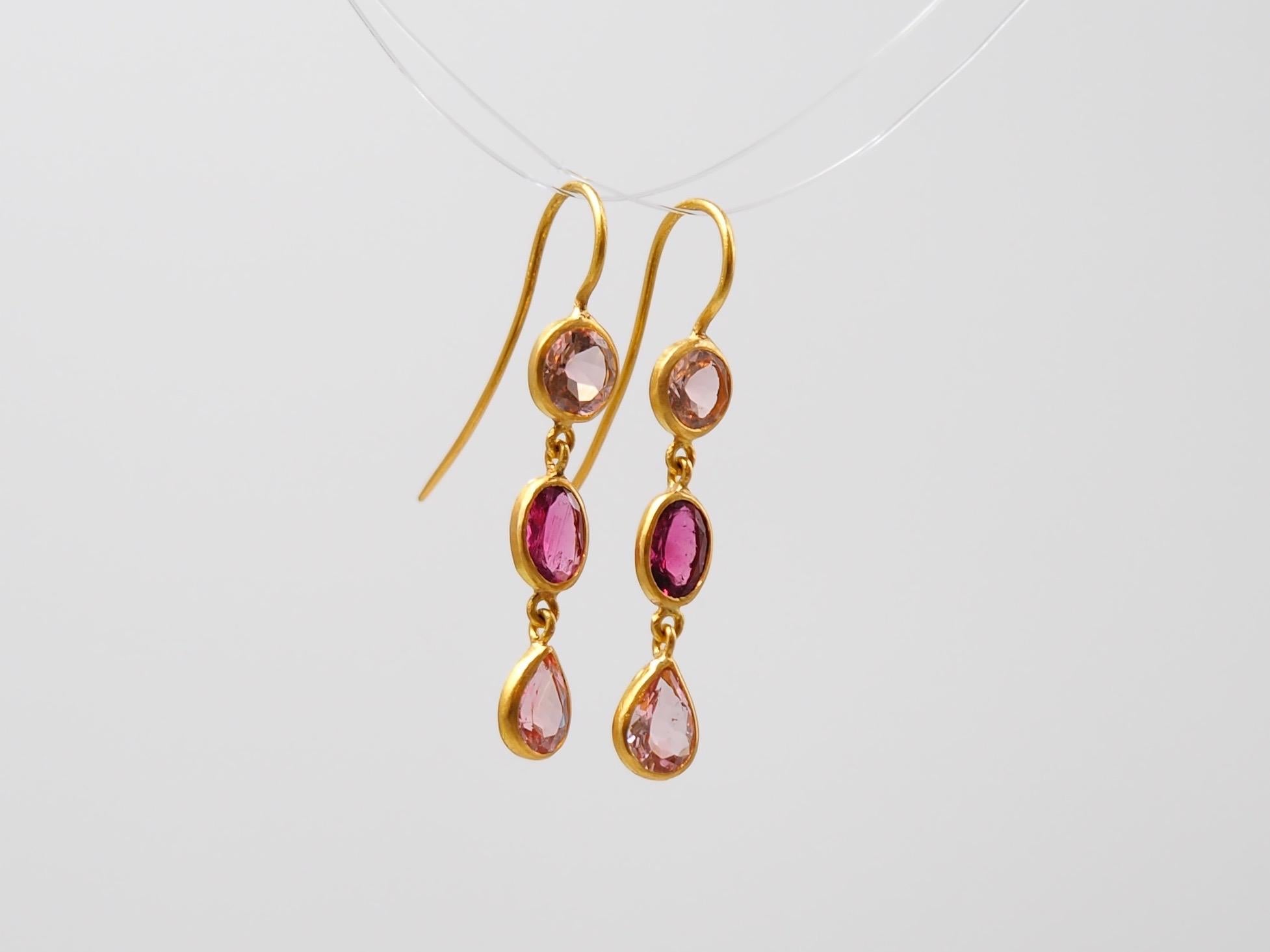 These colourful earrings by Scrives are composed of 6 Tourmalines, 2 rounds light pink - 2 ovals purple pink - 2 drops light pink,
for a total weight of 4.1 cts. 
The stones can exhibit natural and typical inclusions. 

This one-of-a-kind pair of