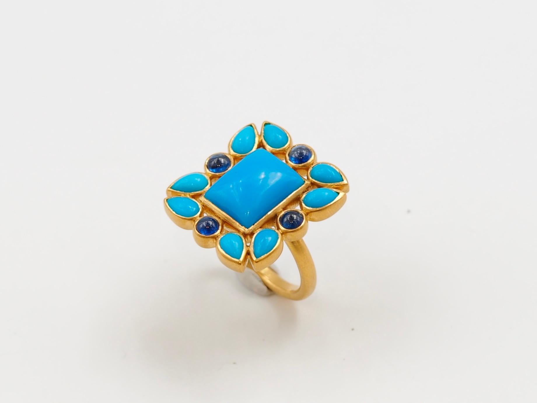 This one-of-a-kind ring by Scrives is composed at its centre of a rectangular natural turquoise cabochon. The turquoise colour is deep blue (4.55 cts) and is surrounded by 8 pear shapes turquoises with very light variation of blues (total weight: