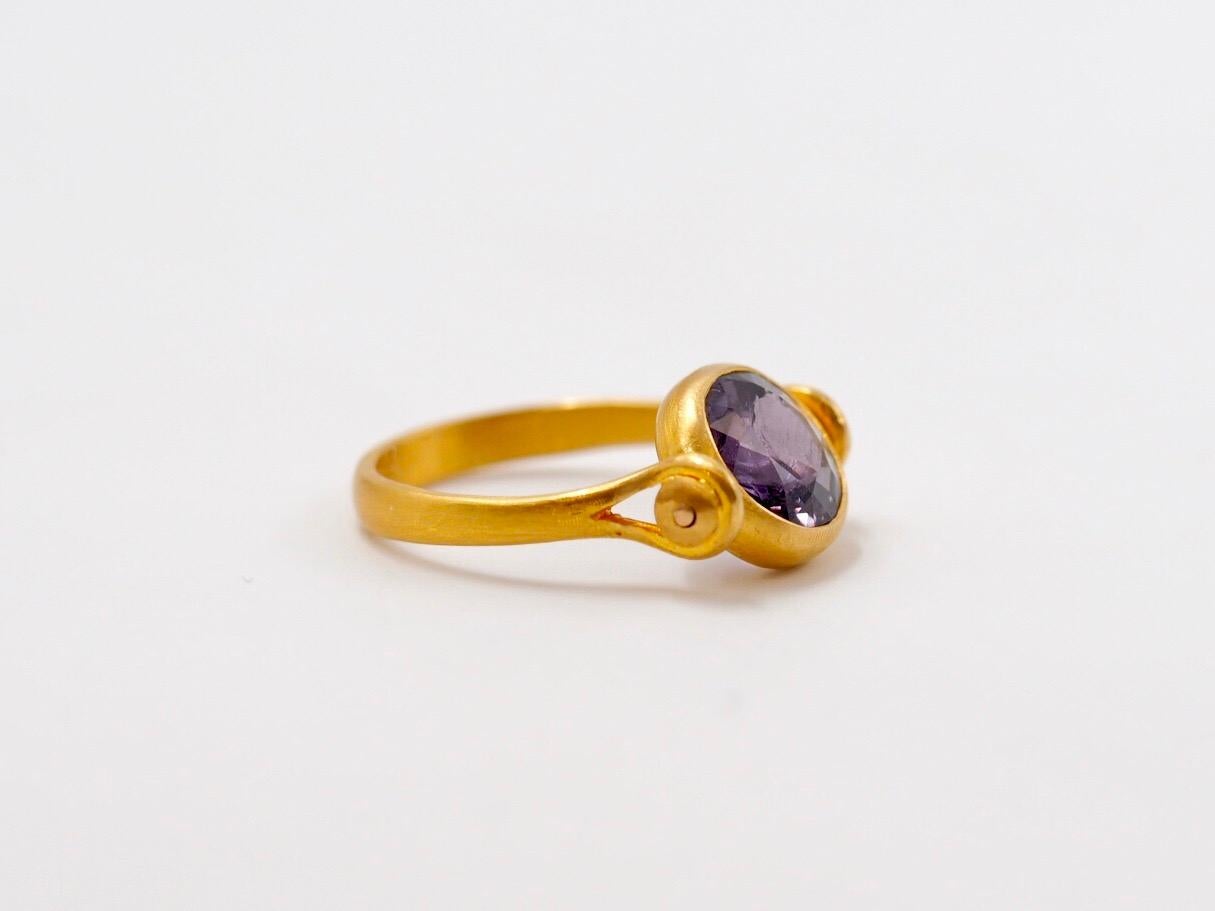 This antique style ring by Scrives is set with a violet faceted spinel of 2.52 cts. 
The central stone and its setting are slightly turning/moving in order to give more comfort. 
The spinel shows natural & typical inclusions ; little lignes of