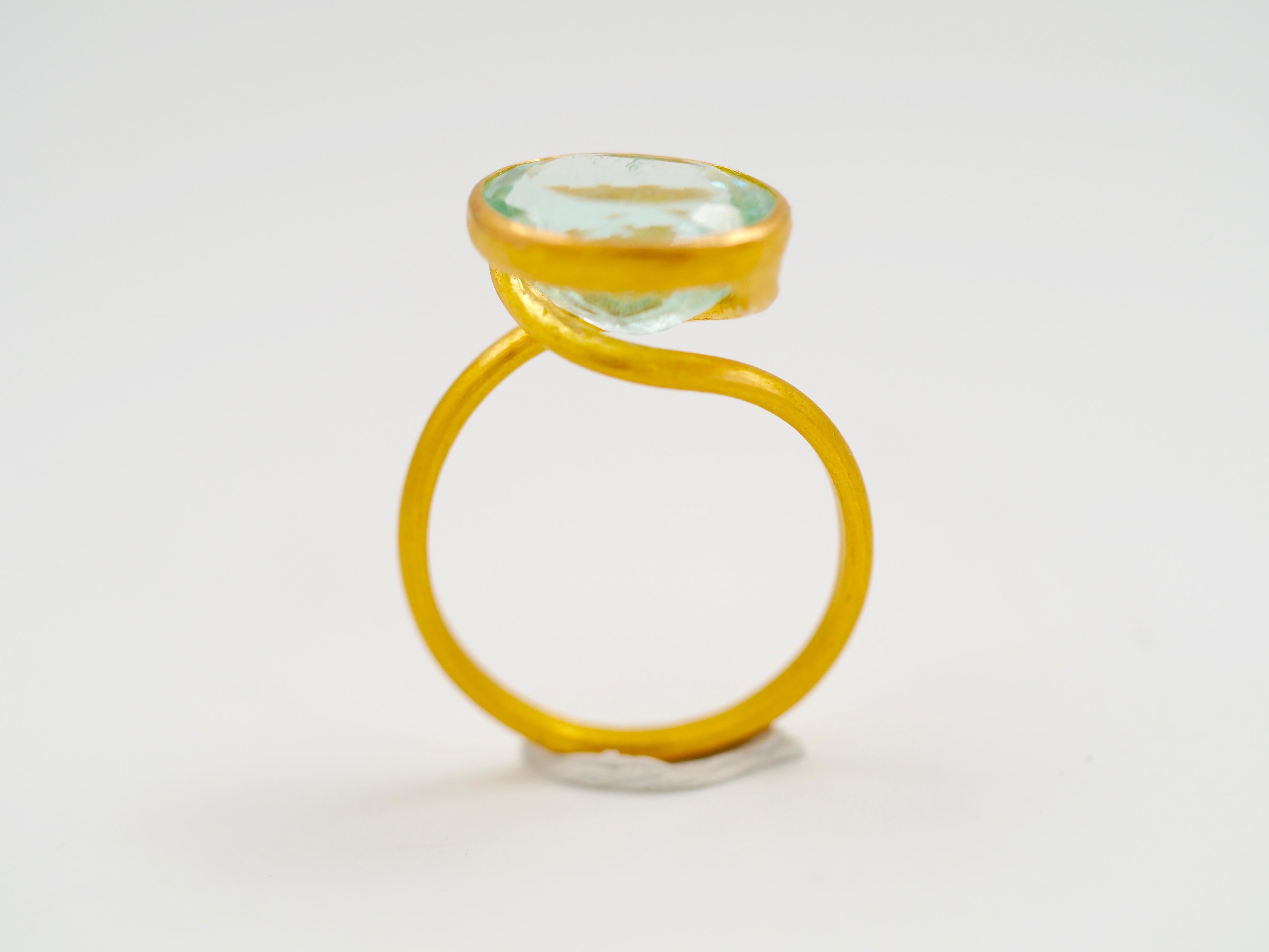 This delicate ring by Scrives is composed of a water blueish green tourmaline of 5.95cts. 
This design allows light to come into the stone from multiple directions and put into highlight the stone. This ring design has been conceived to be worn