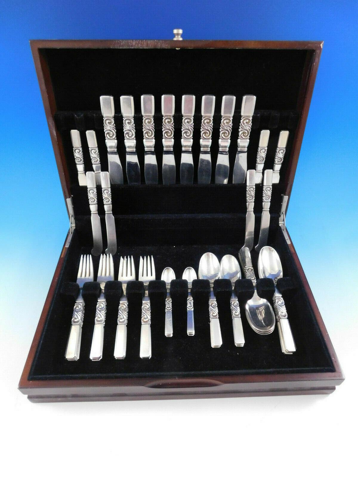 Superb scroll by Georg Jensen Danish sterling silver flatware set - 56 pieces. This set includes:

8 luncheon knives, 7 3/4