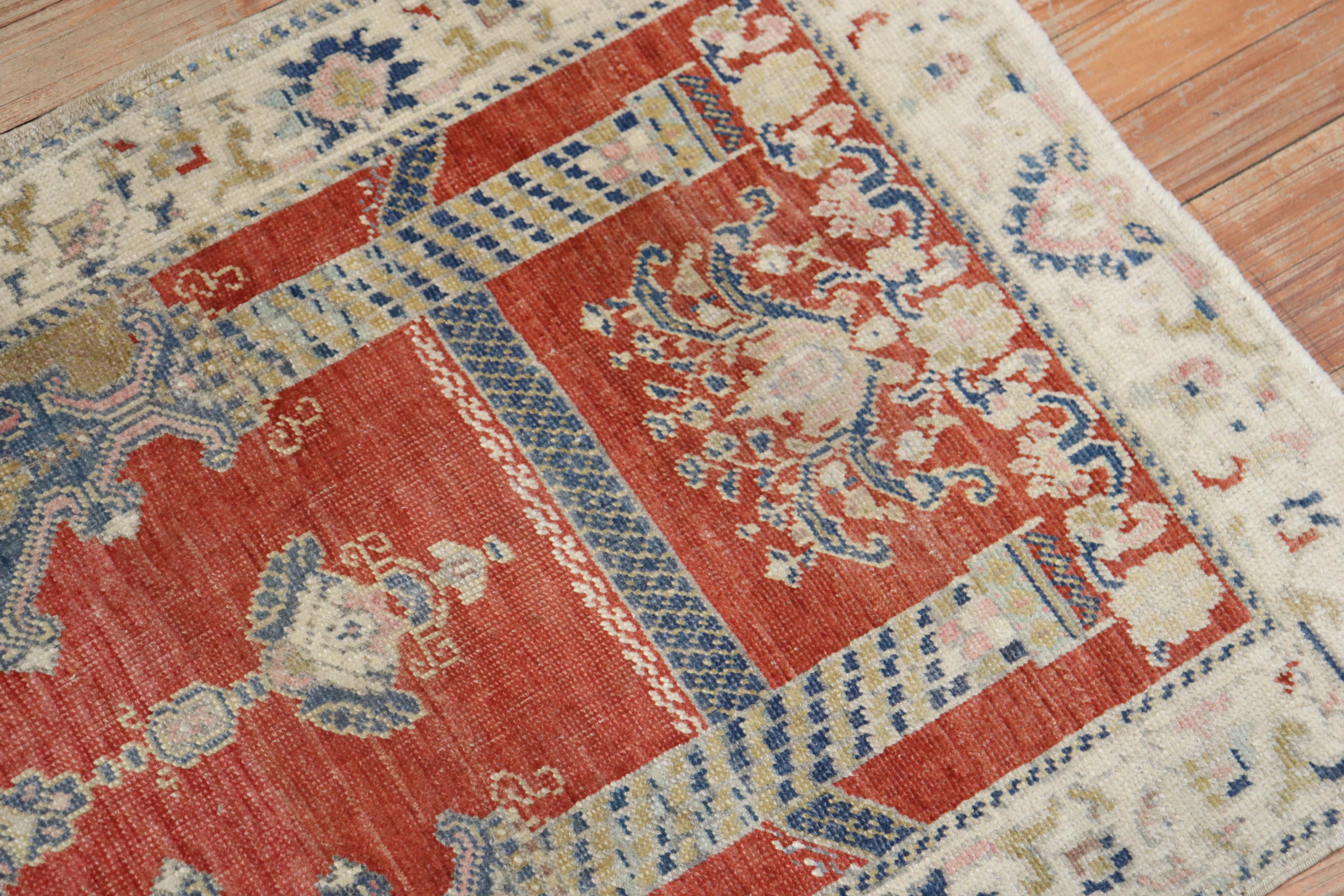 An early 20th century wool Turkish Sivas mat square size rug with a double scroll column prayer motif on a brick color field, 

circa 1900. Measures: 2'2