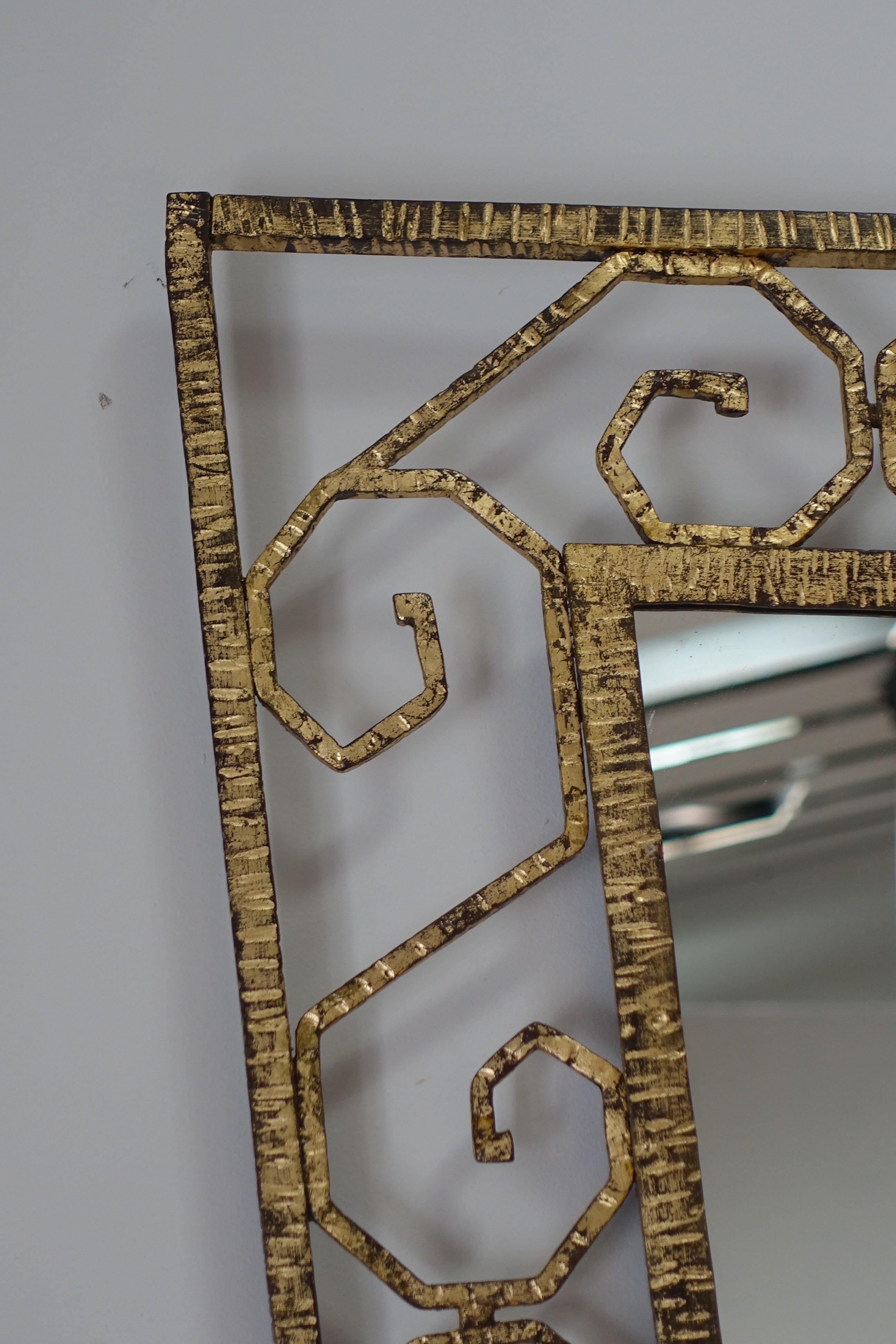 Scroll Pattern Gold Gilt Iron Shield Shaped Mirror, France, 1930s In Good Condition For Sale In New York, NY