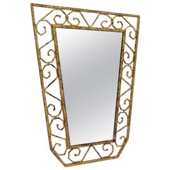 Vintage Scroll Pattern Gold Gilt Iron Shield Shaped Mirror, France, 1930s