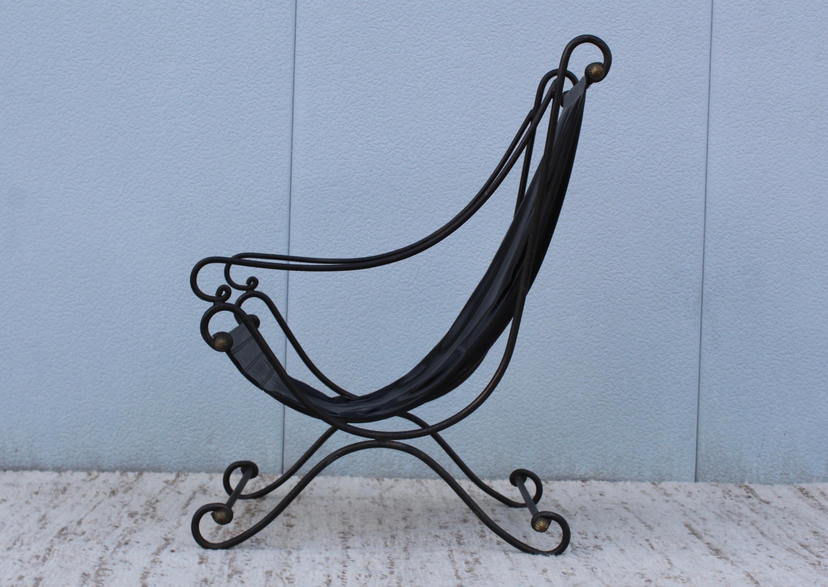 1970s scrolled iron with bronze detail sling lounge chair in the style of Maison Jansen.