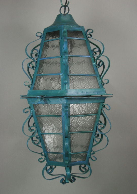 A scrolled iron hand painted lantern. One internal light. Supplied with 2 feet of chain and canopy. Takes one 100 watt Edison based bulb.
 