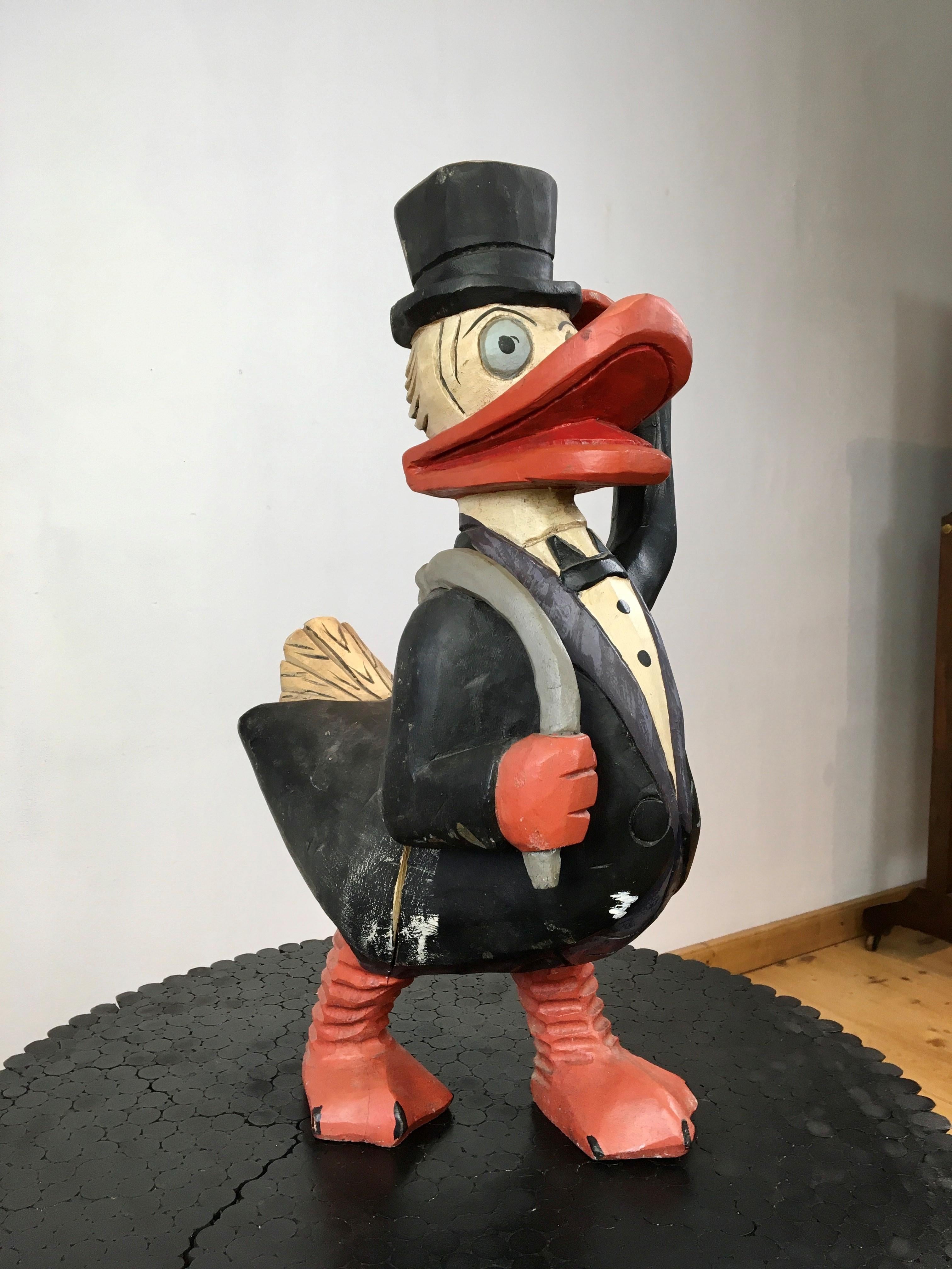 Scrooge McDuck - Dagobert Duck sculpture. 
Cartoon character created in 1947 for Walt Disney and especially known due his famous nephew Donald Duck. 

This painted wooden sculpture is a great decorative object for someone who loves Walt Disney,