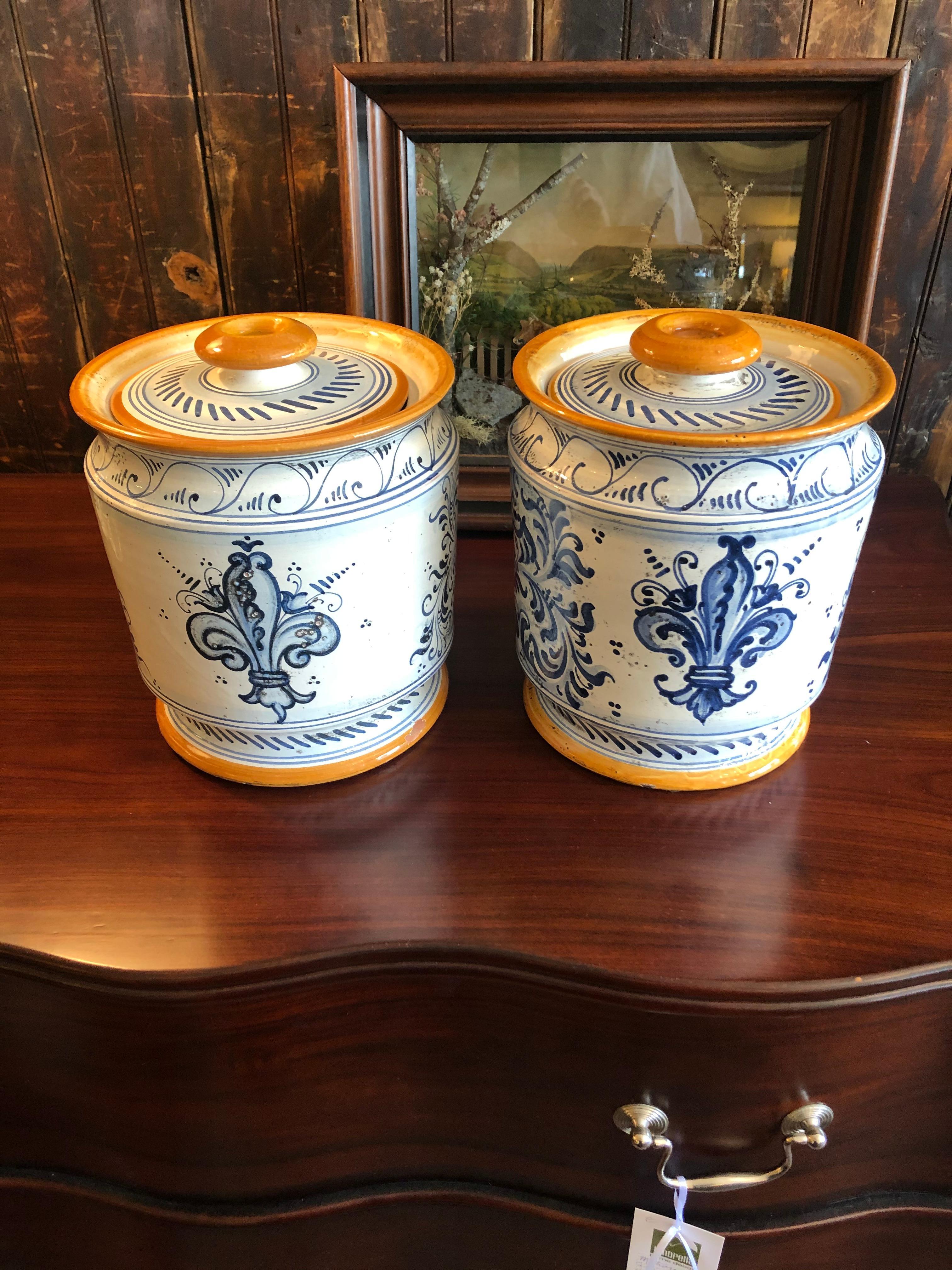 Beautifully painted ceramic lidded jar having a matched male and female with Provencal style decoration and color palette.