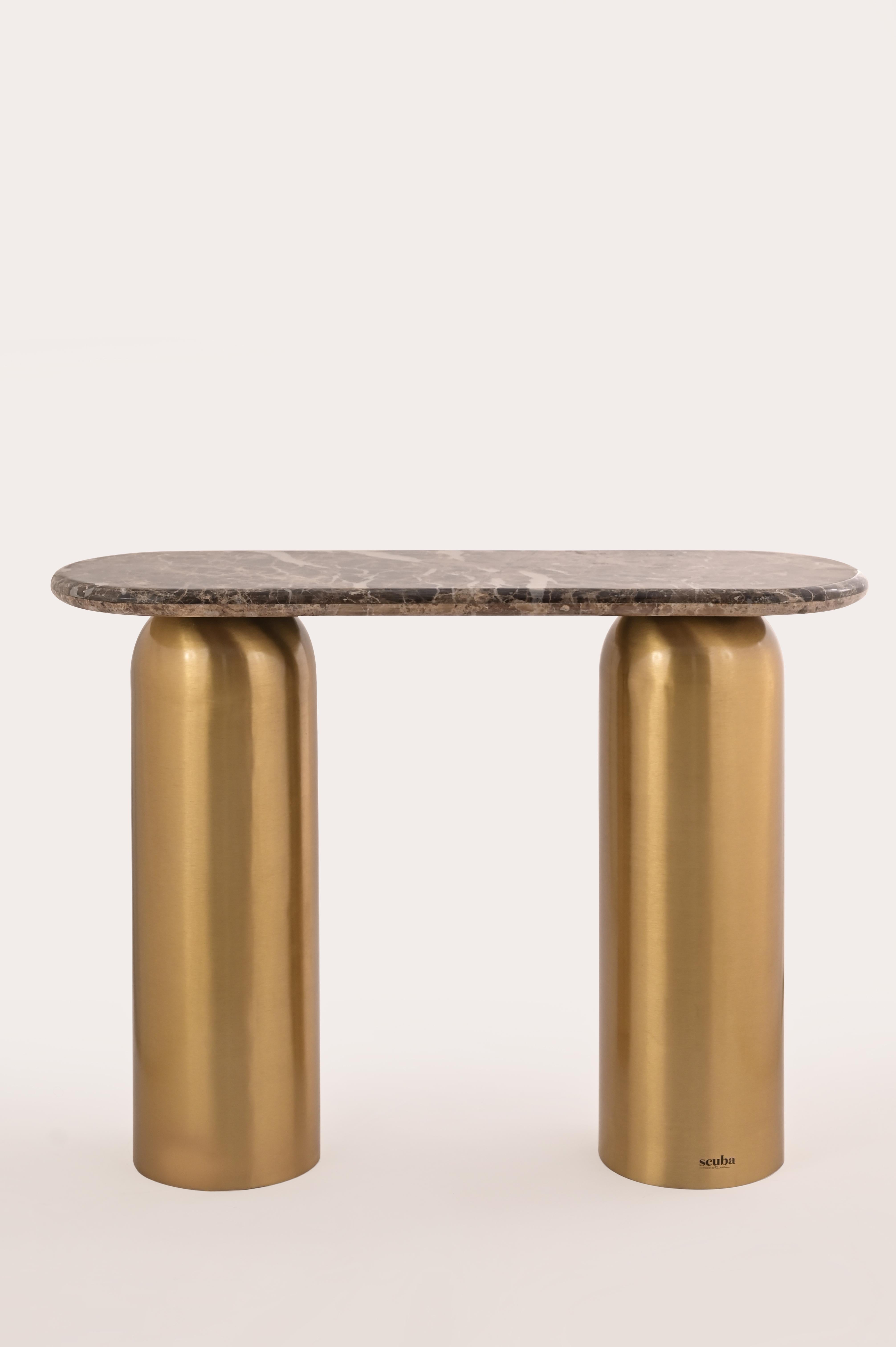 Whether you need a landing spot for your keys or a stage for your favorite decor pieces, this handcrafted console table has your back. Unlike its round sibling, the Scuba Side Table, this metal console table means business with its narrow