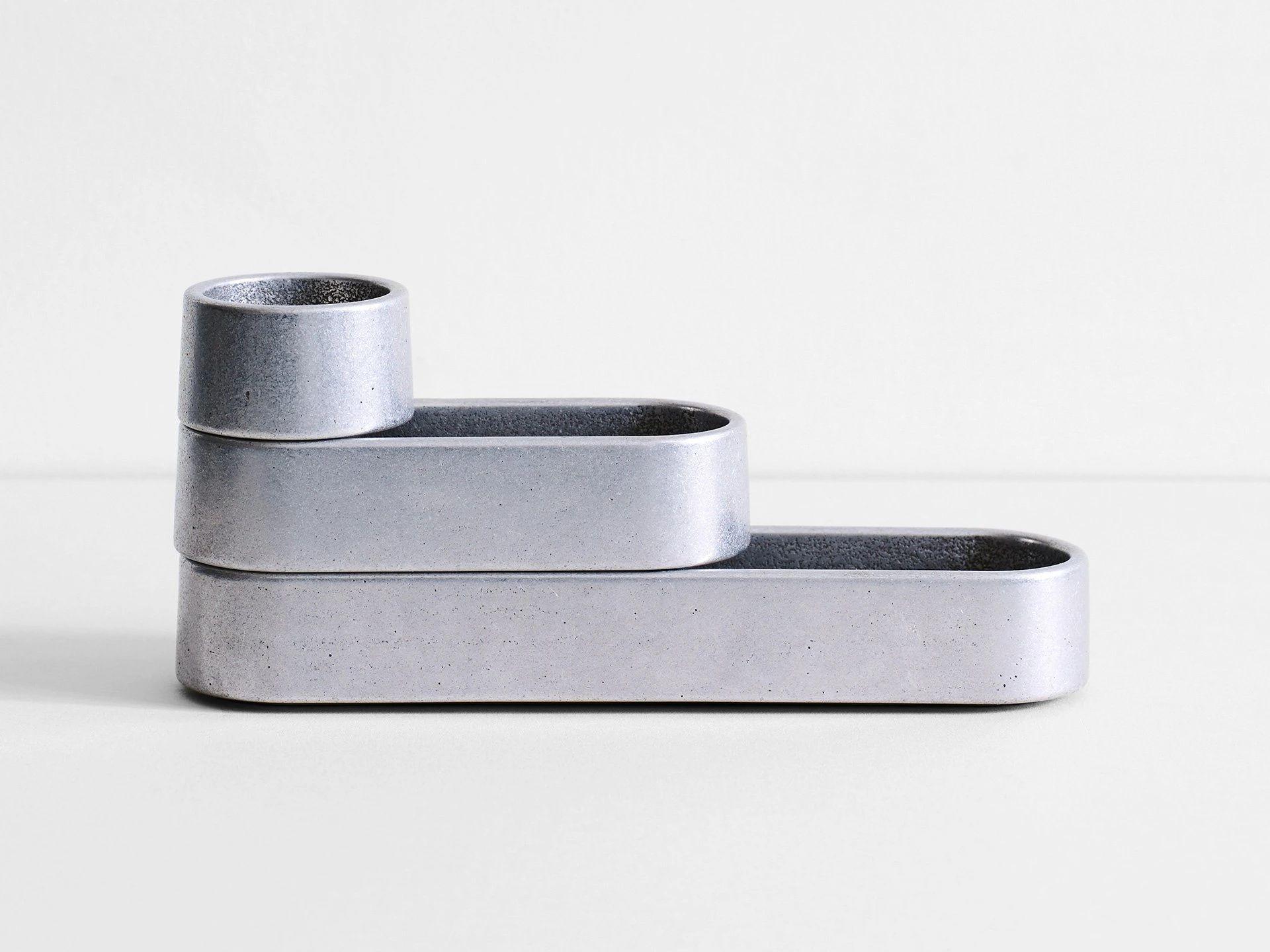 Sculpted aluminum stack trays by Henry Wilson
Dimensions: L 21 x W 5 x H 10
Materials: Aluminum 

The stack trays are sold in a set of three that can be used together or individually. Group them on your desk, dining table, or next to the bed.