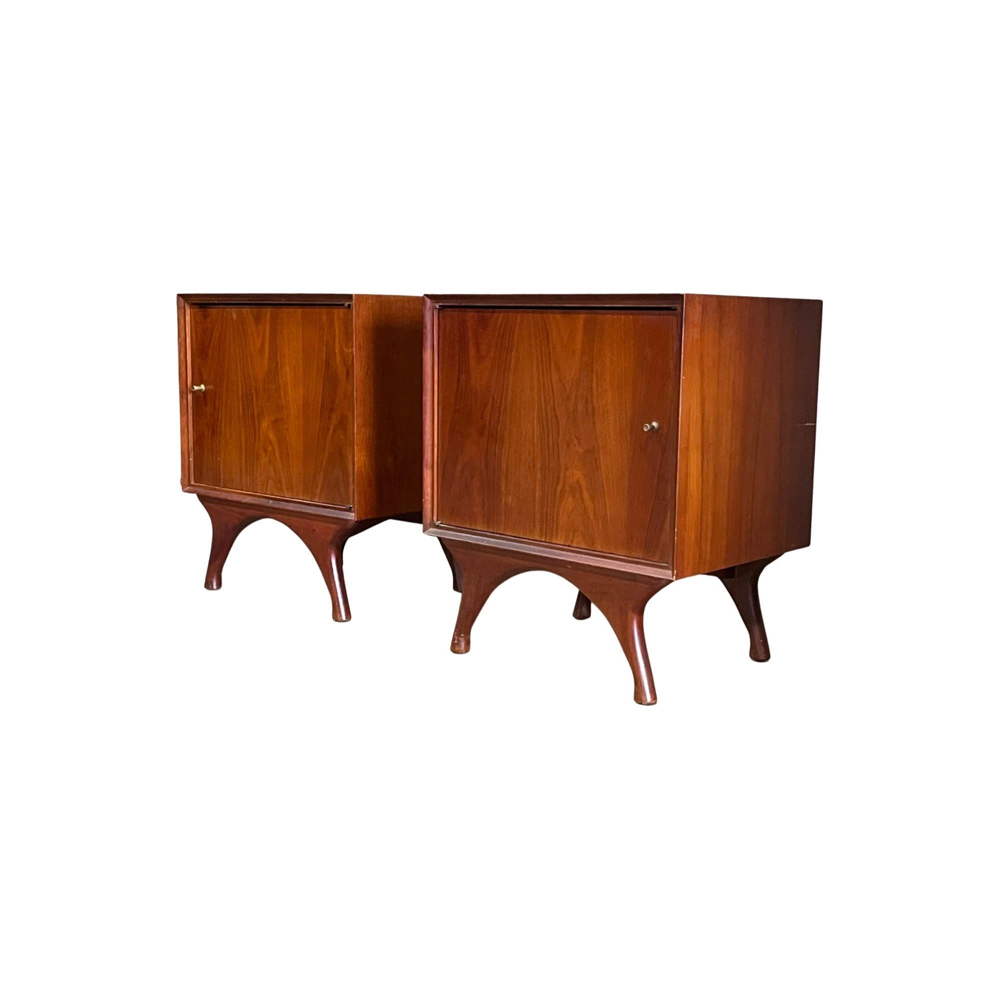 Step into the allure of the 1960s with our Vintage Mid Century Modern Pair of Nightstands, exuding timeless charm. Crafted to meticulous standards, these nightstands offer a spacious interior shelf discreetly tucked behind a minimalistic door. Their